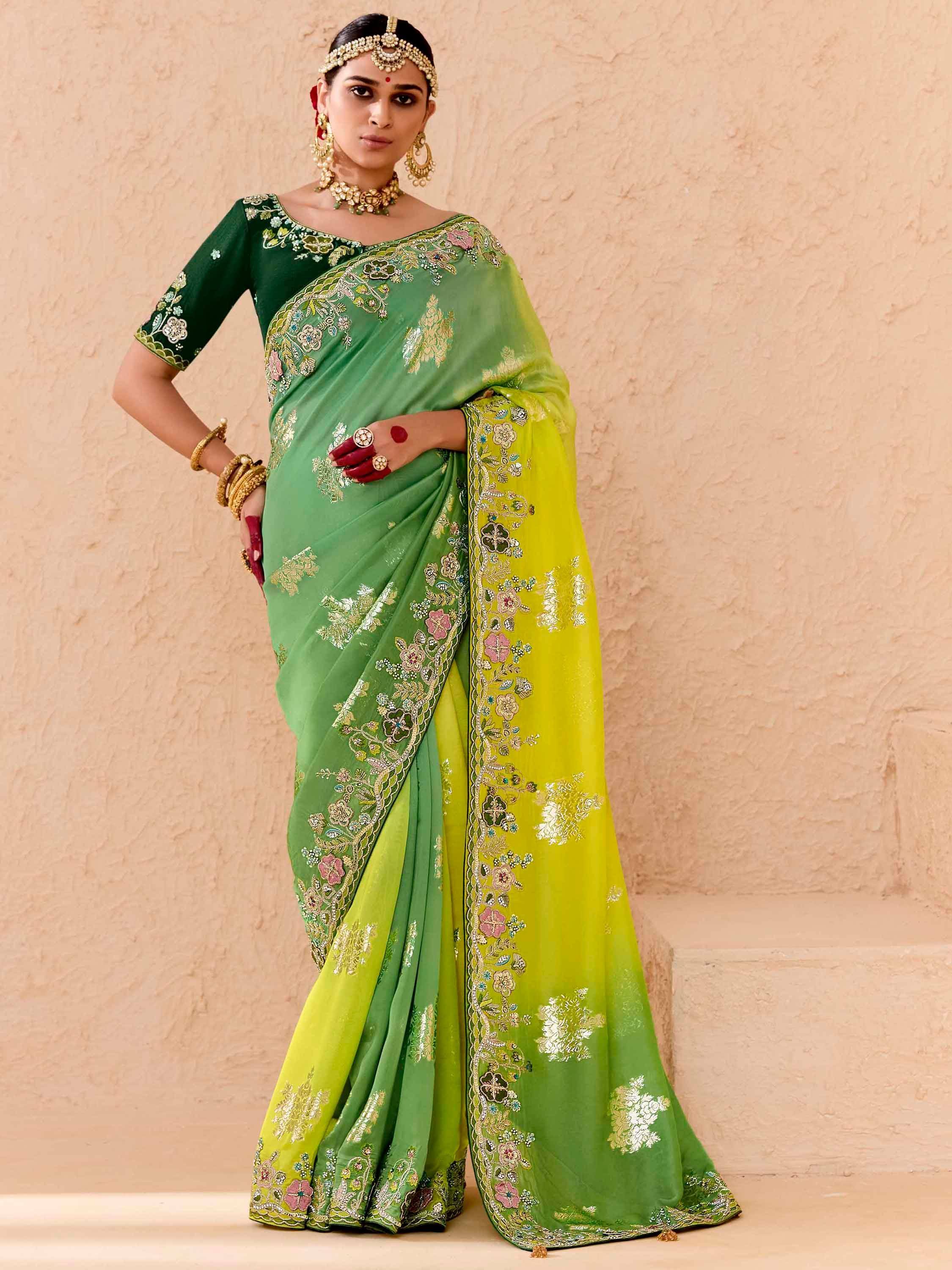Green embroidered saree with floral motifs, perfect for Indian ethnic wear and festive occasions.