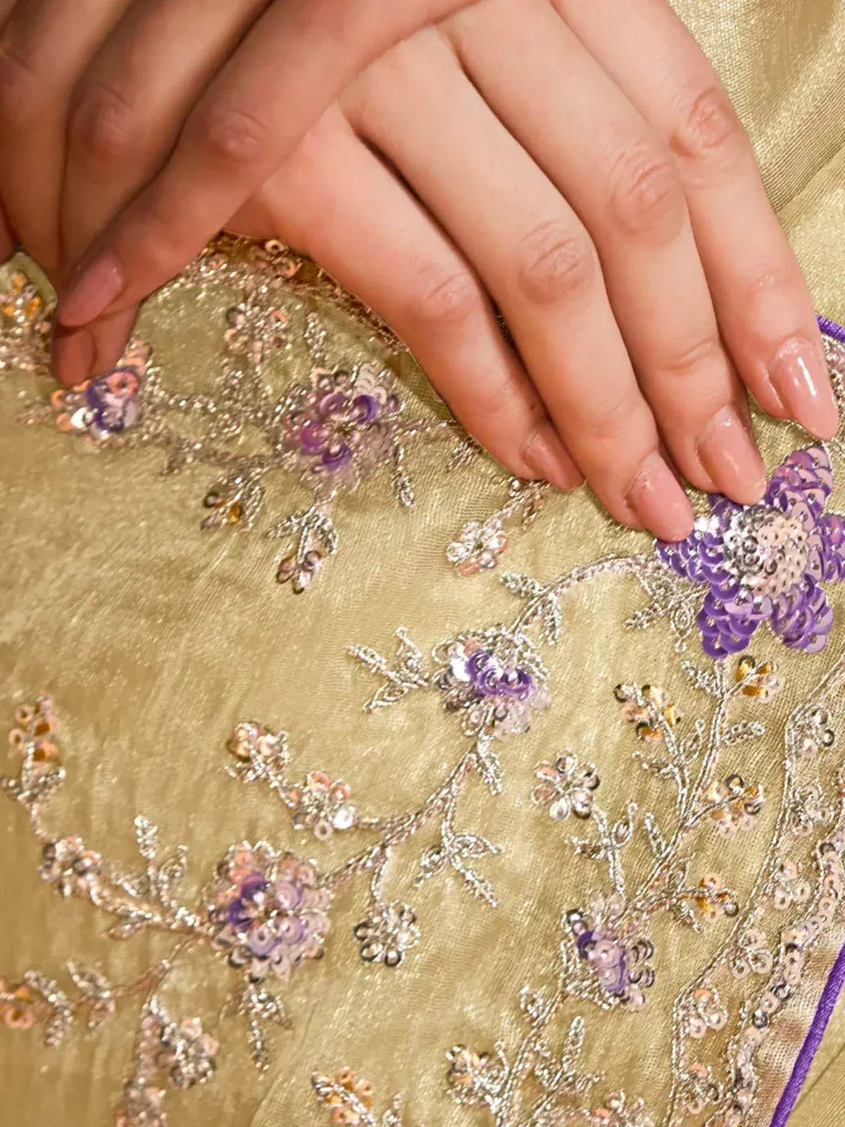 Elegant gold ethnic wear with purple floral sequin embroidery, perfect for Indian designer lehenga or saree