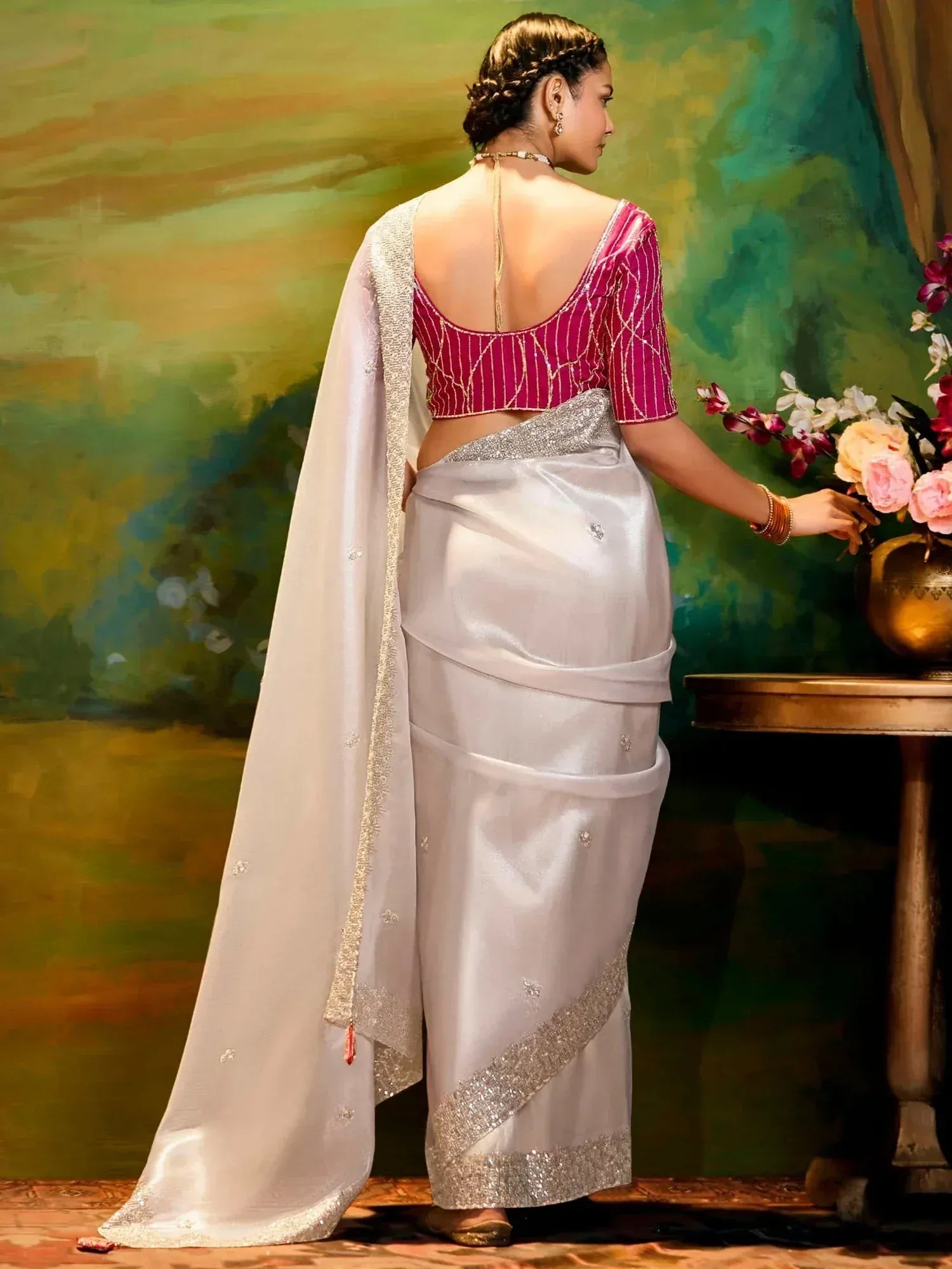 Elegant white saree with silver embroidery and pink blouse, perfect for Indian ethnic wear occasions
