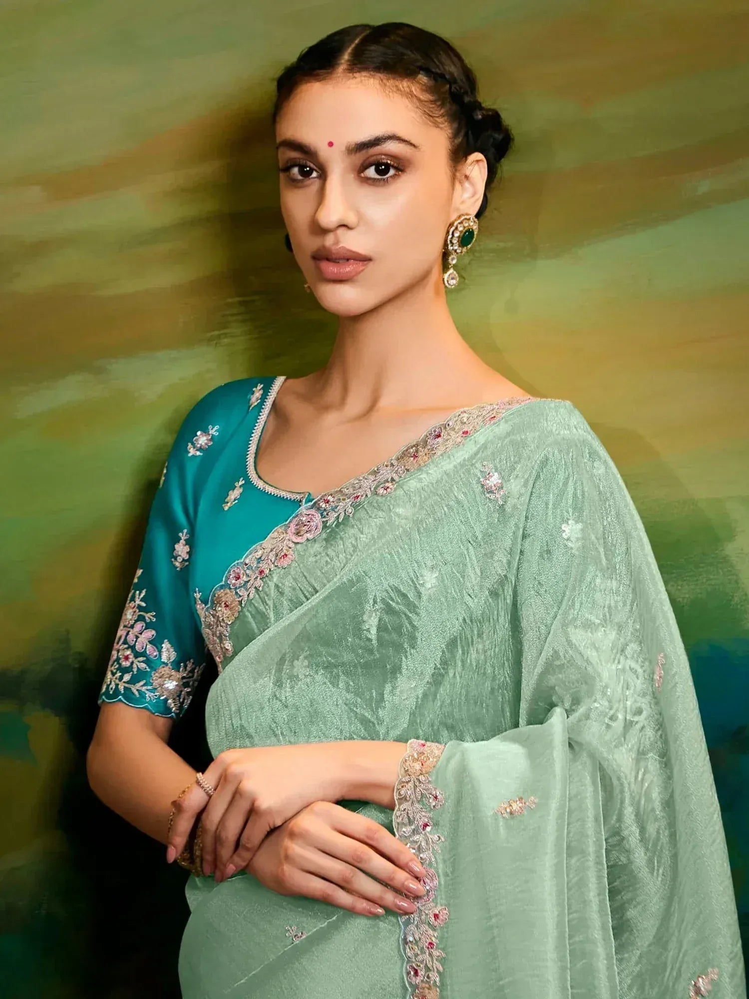 Mint green embroidered saree with teal blouse, perfect for Indian ethnic occasions