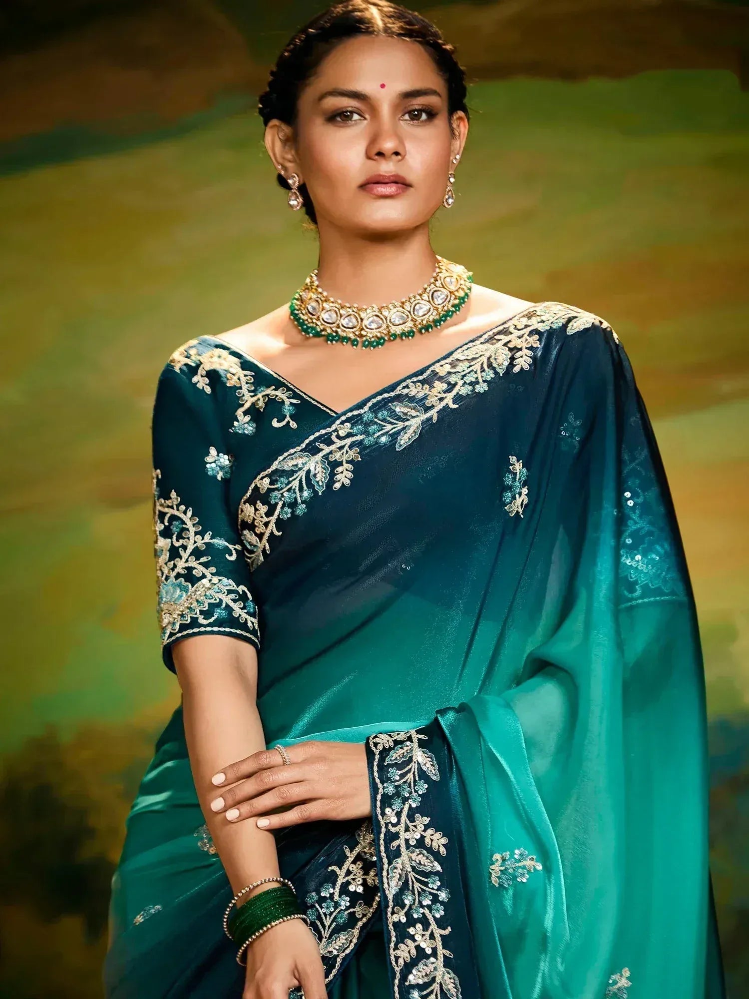 Teal embroidered saree with gold detailing, perfect for Indian ethnic wear and festive occasions.