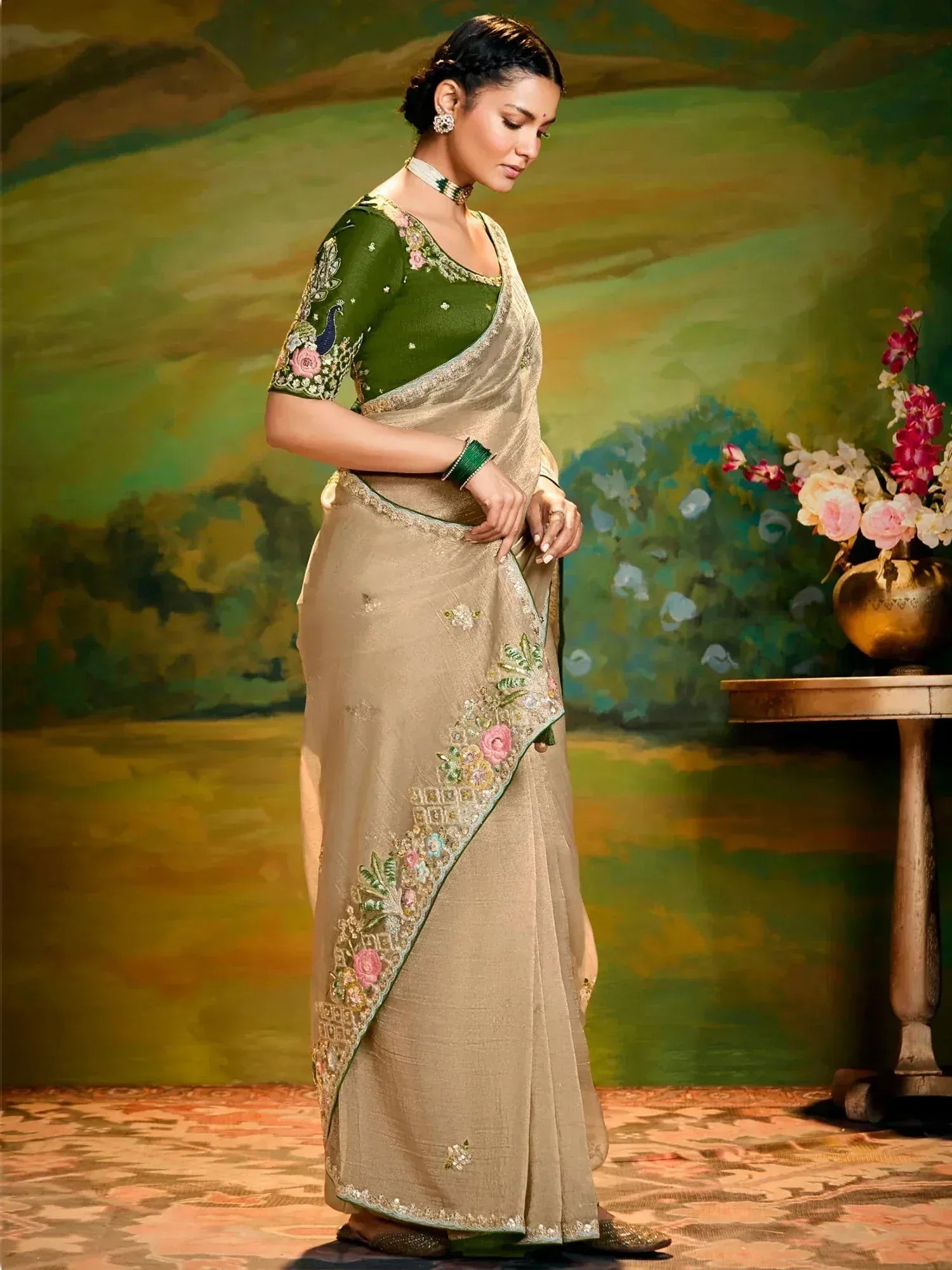 Elegant beige saree with floral embroidery and green blouse, perfect for Indian ethnic occasions.