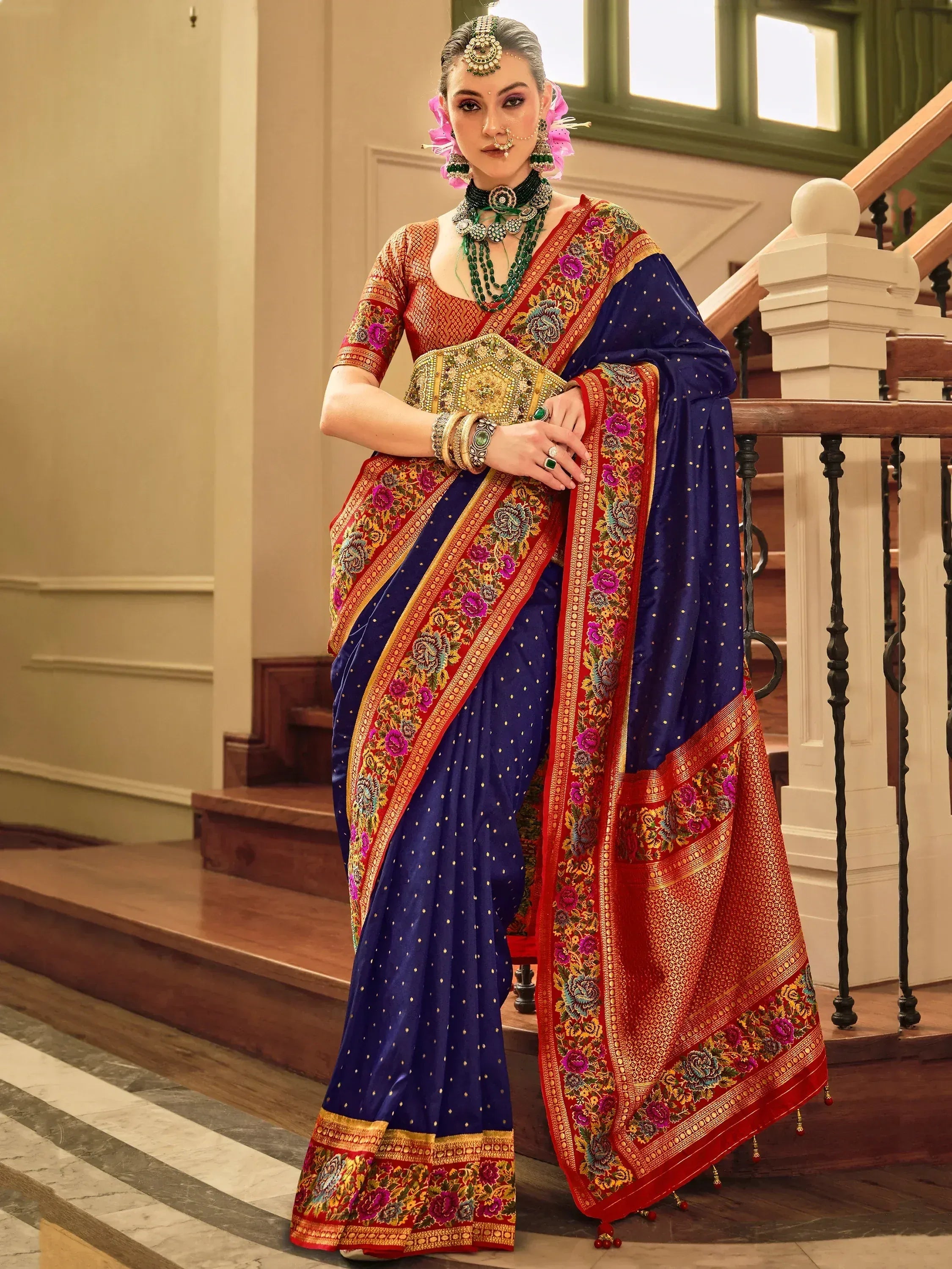 Elegant blue and red embroidered saree with floral border, perfect for Indian ethnic occasions