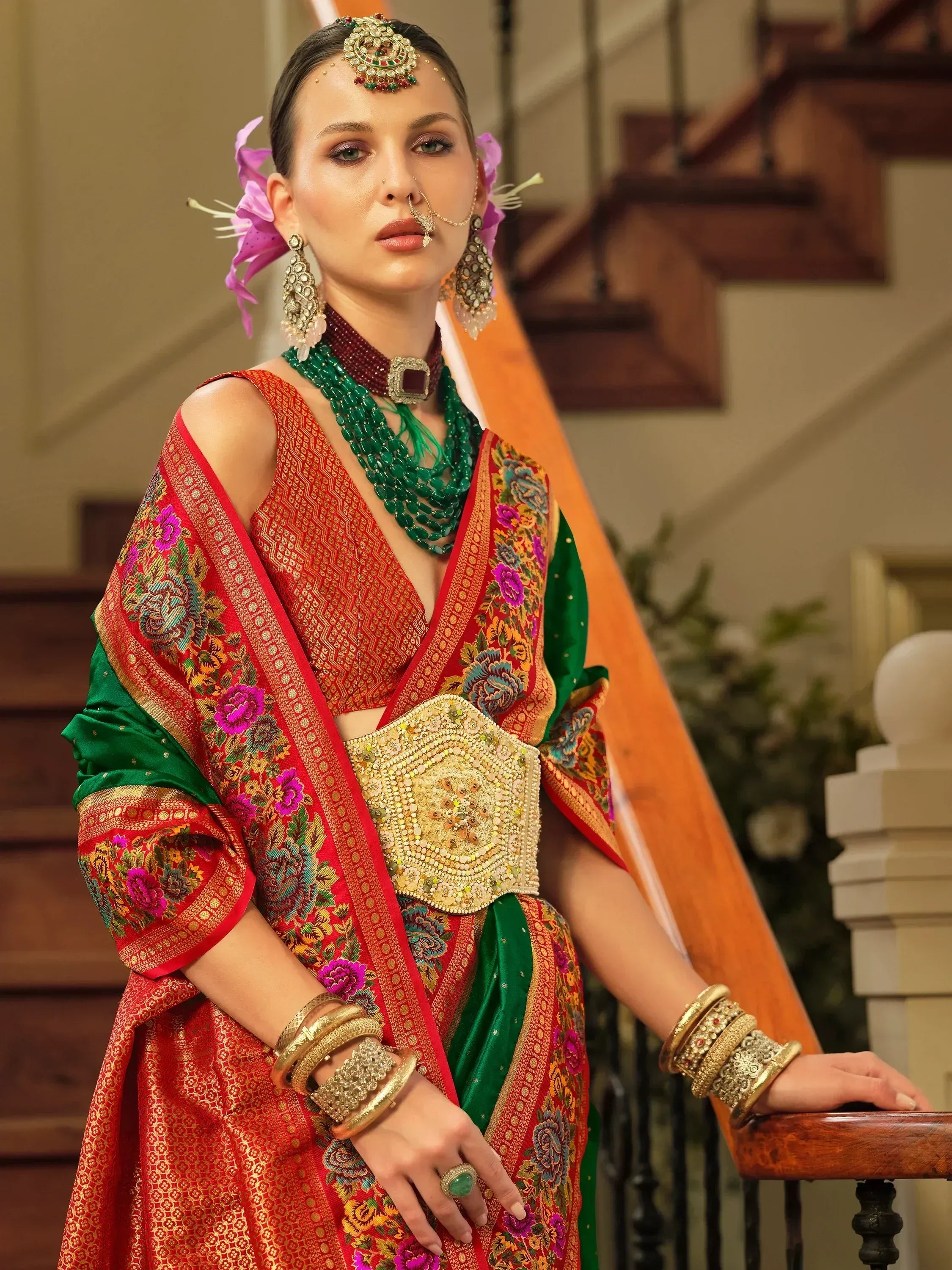 Red and green embroidered lehenga choli with gold belt, traditional Indian ethnic wear for weddings