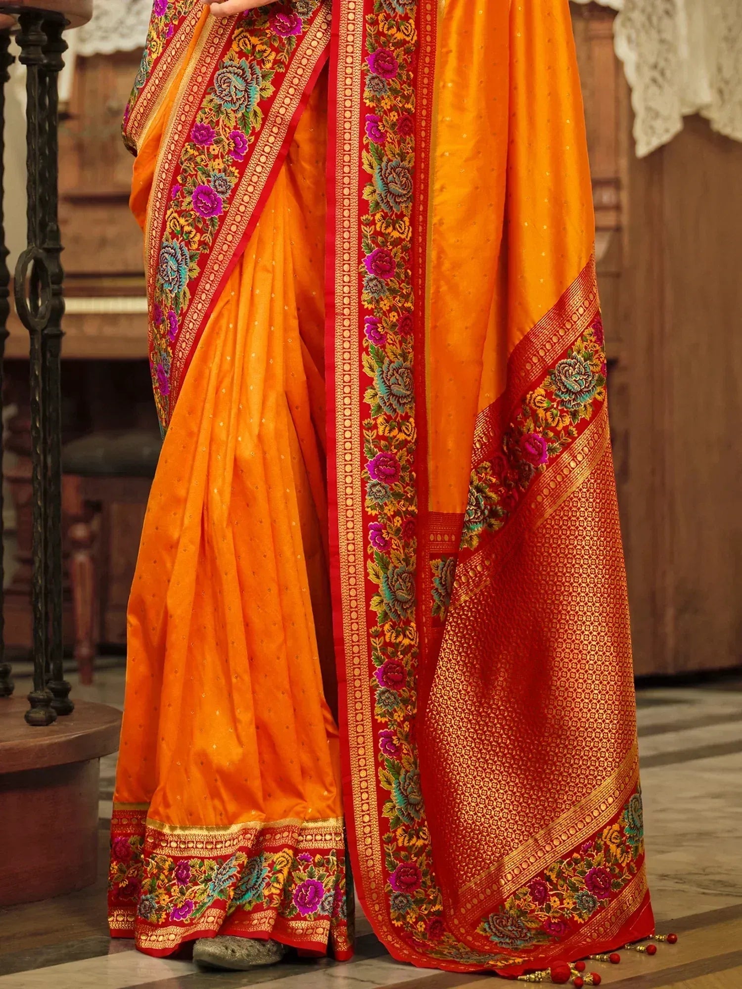 Vibrant orange saree with red floral embroidery and gold border, Indian ethnic wear
