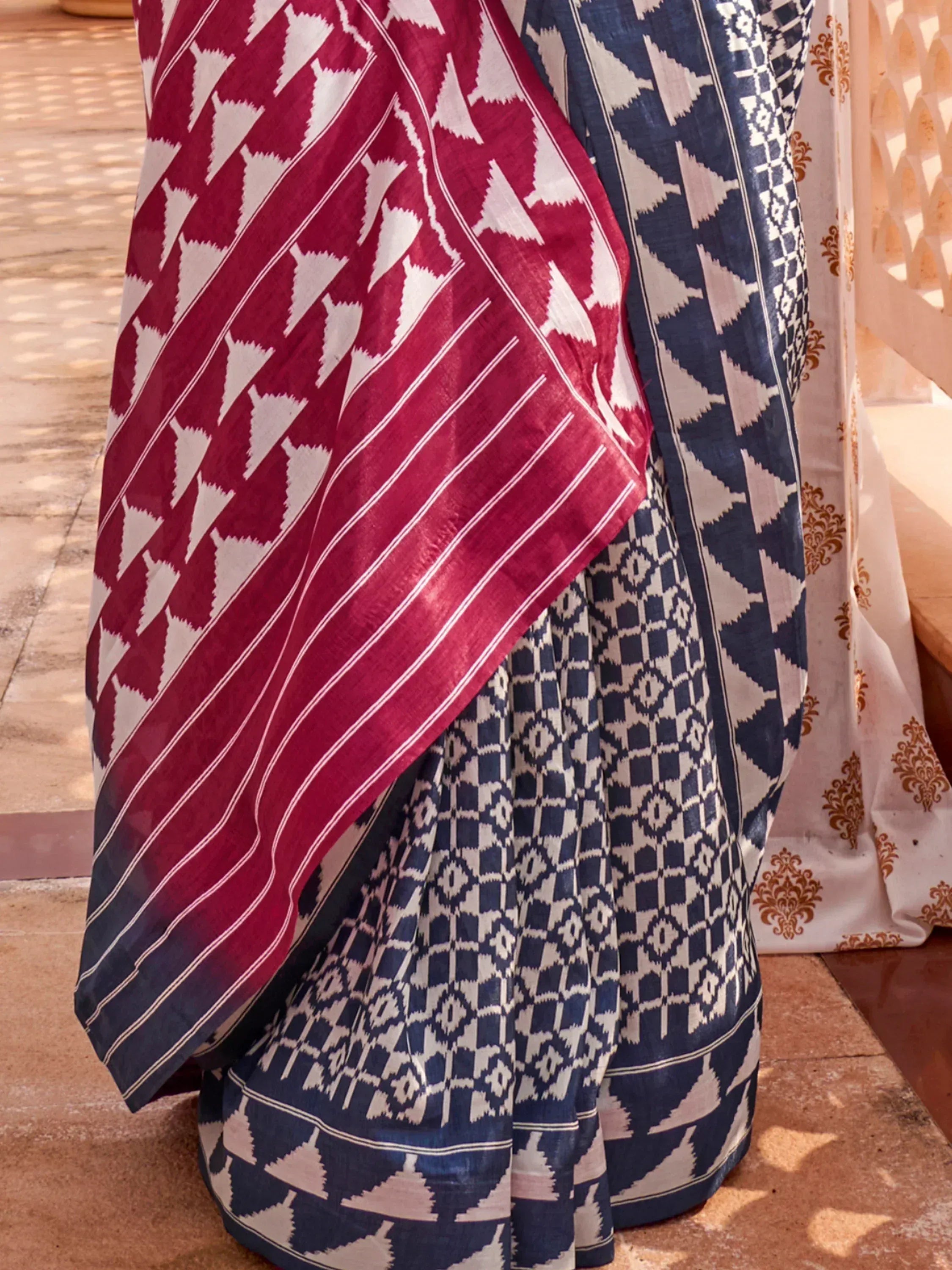 Blue and red ikat print saree with geometric patterns, traditional Indian ethnic wear