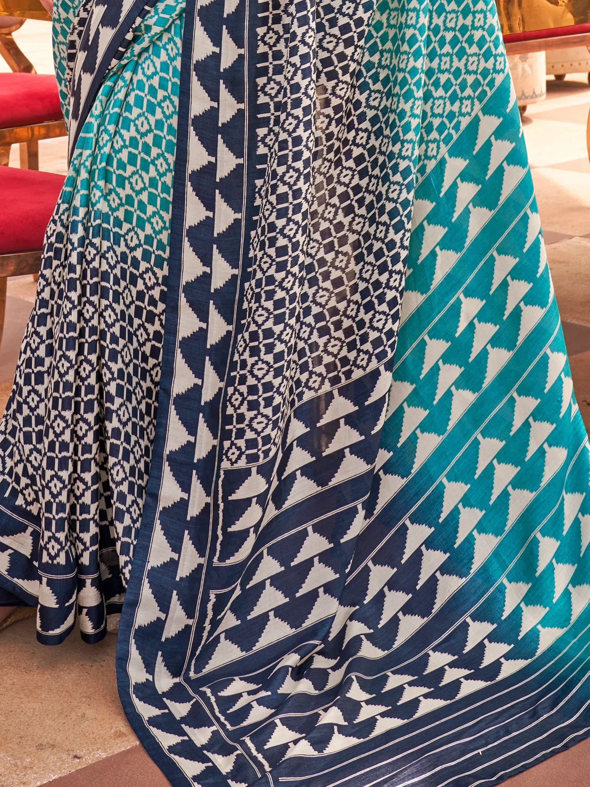 Blue and teal ikat saree with geometric patterns, ethnic Indian wear