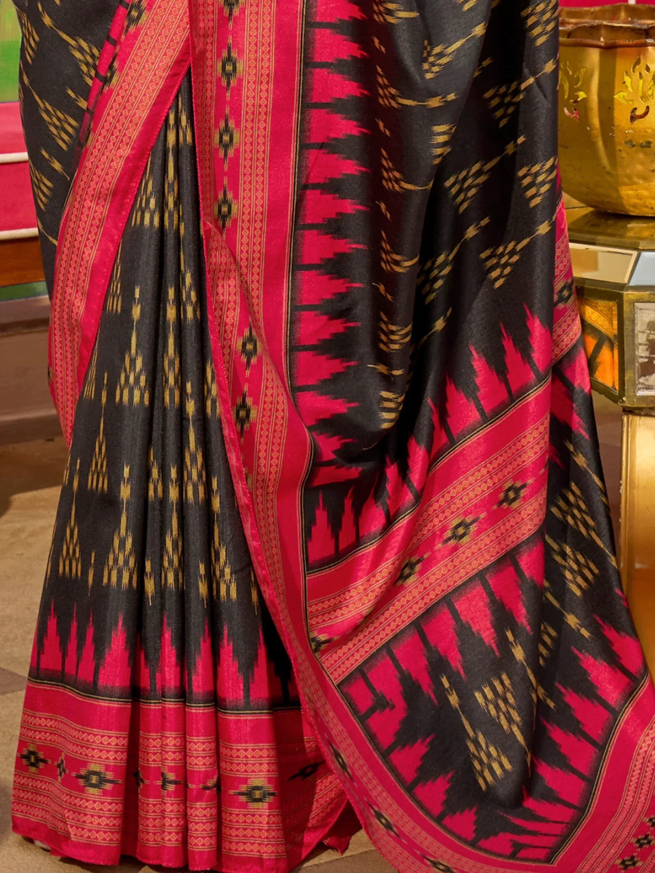 Black and pink ikat saree with gold geometric patterns, ethnic Indian wear