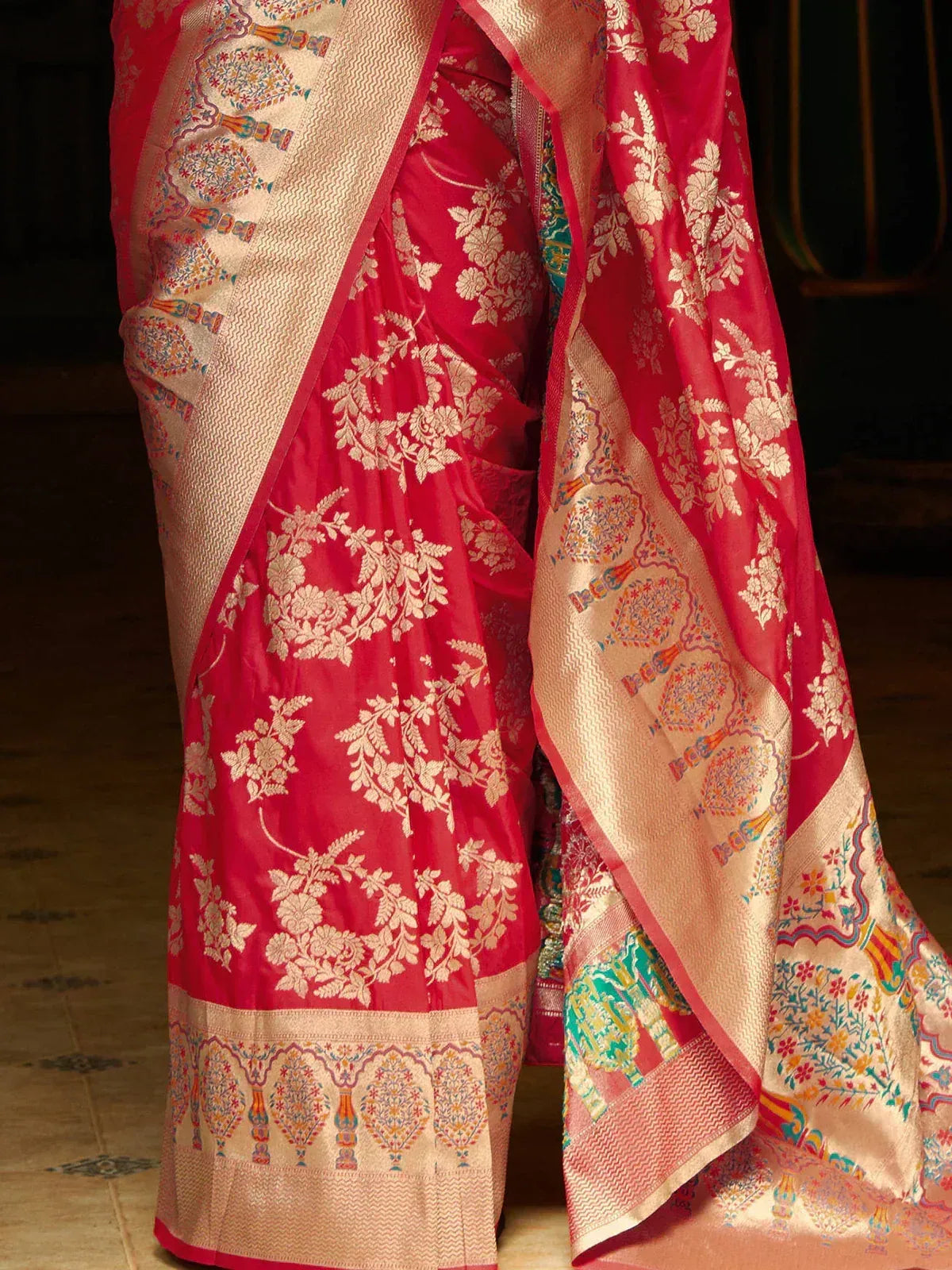 Red floral Banarasi saree with gold zari border and intricate woven motifs, perfect for Indian ethnic occasions