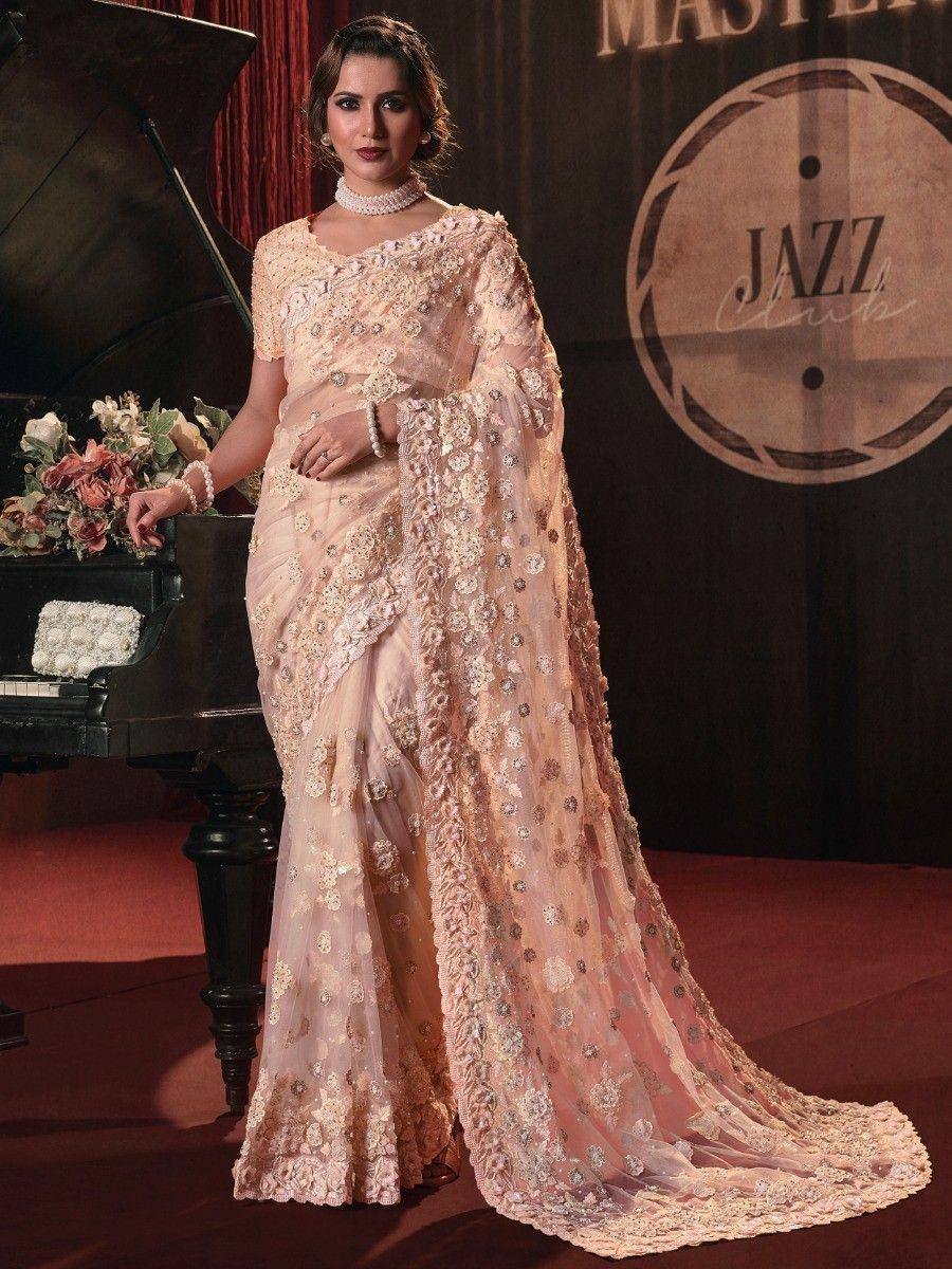 Elegant peach designer saree with floral embroidery, perfect for weddings and parties