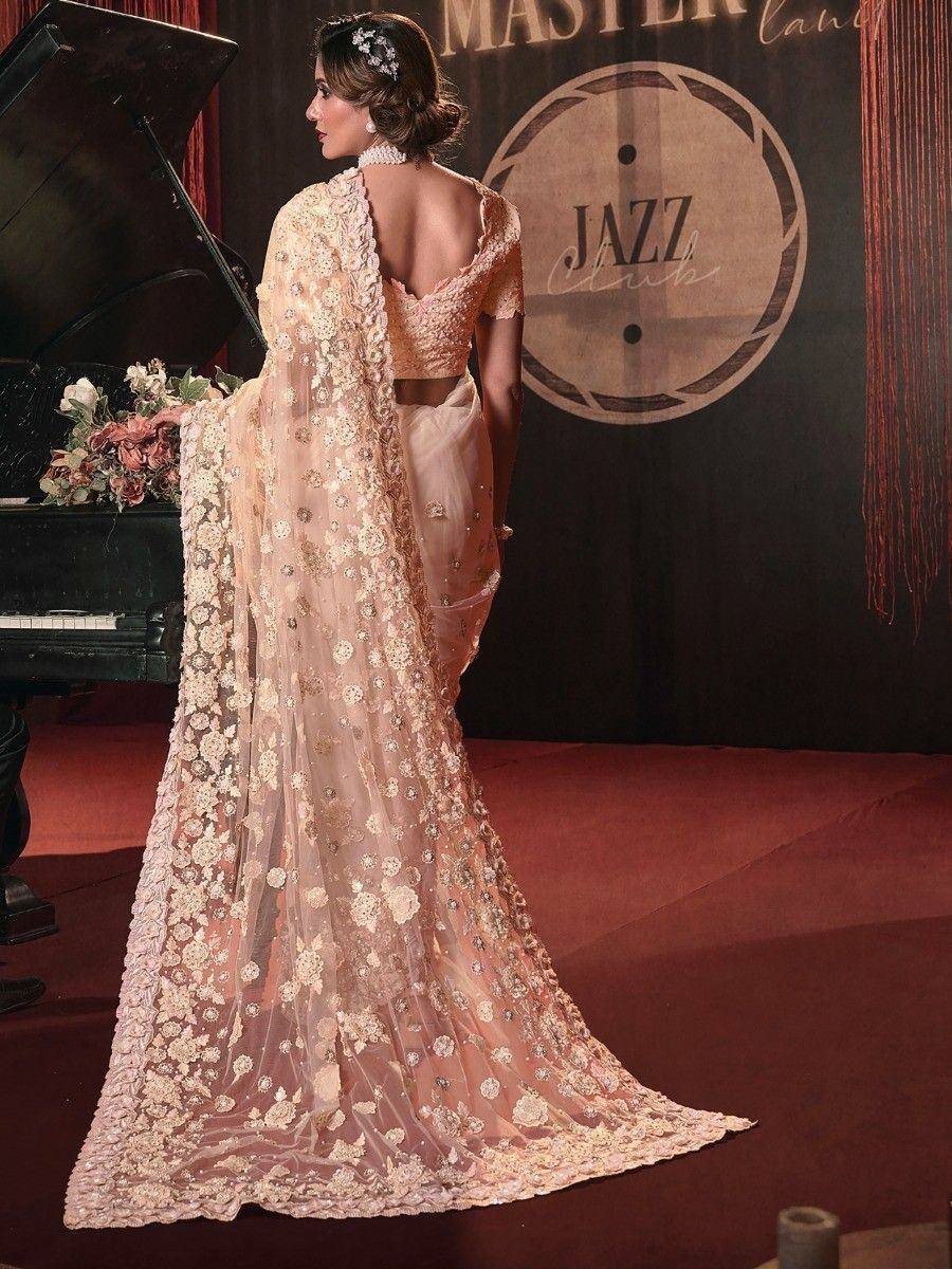 Elegant peach designer saree with floral embroidery, perfect for weddings and parties