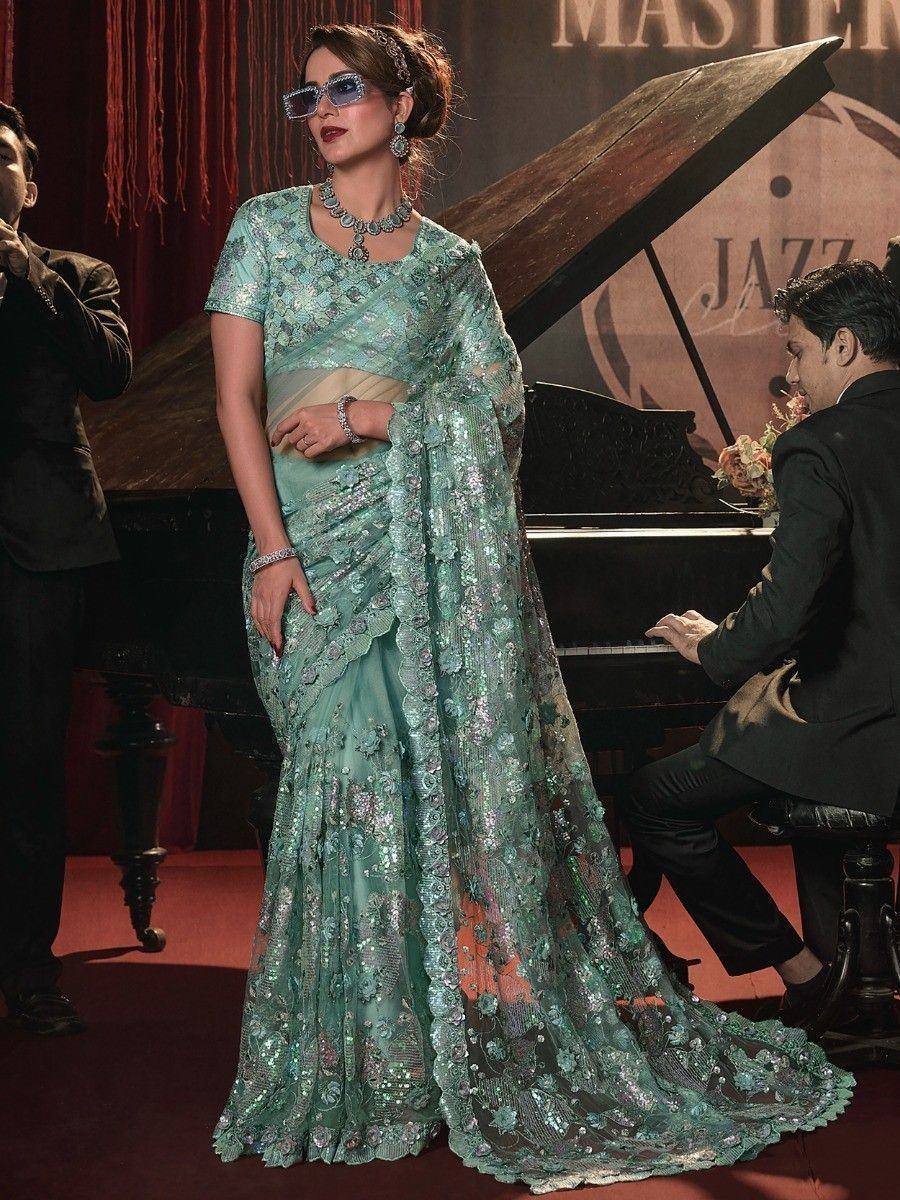Elegant mint green designer saree with floral embroidery and sequins, perfect for ethnic events and parties.
