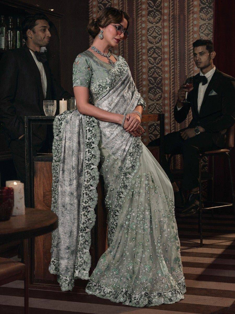 Elegant mint green embroidered saree with floral detailing, perfect for Indian ethnic events and weddings.