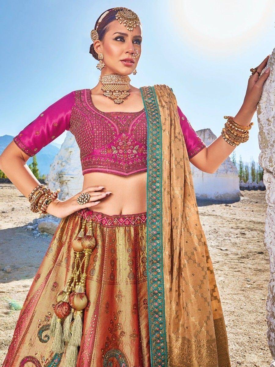 Pink and gold embroidered lehenga choli with dupatta, traditional Indian ethnic wear for weddings