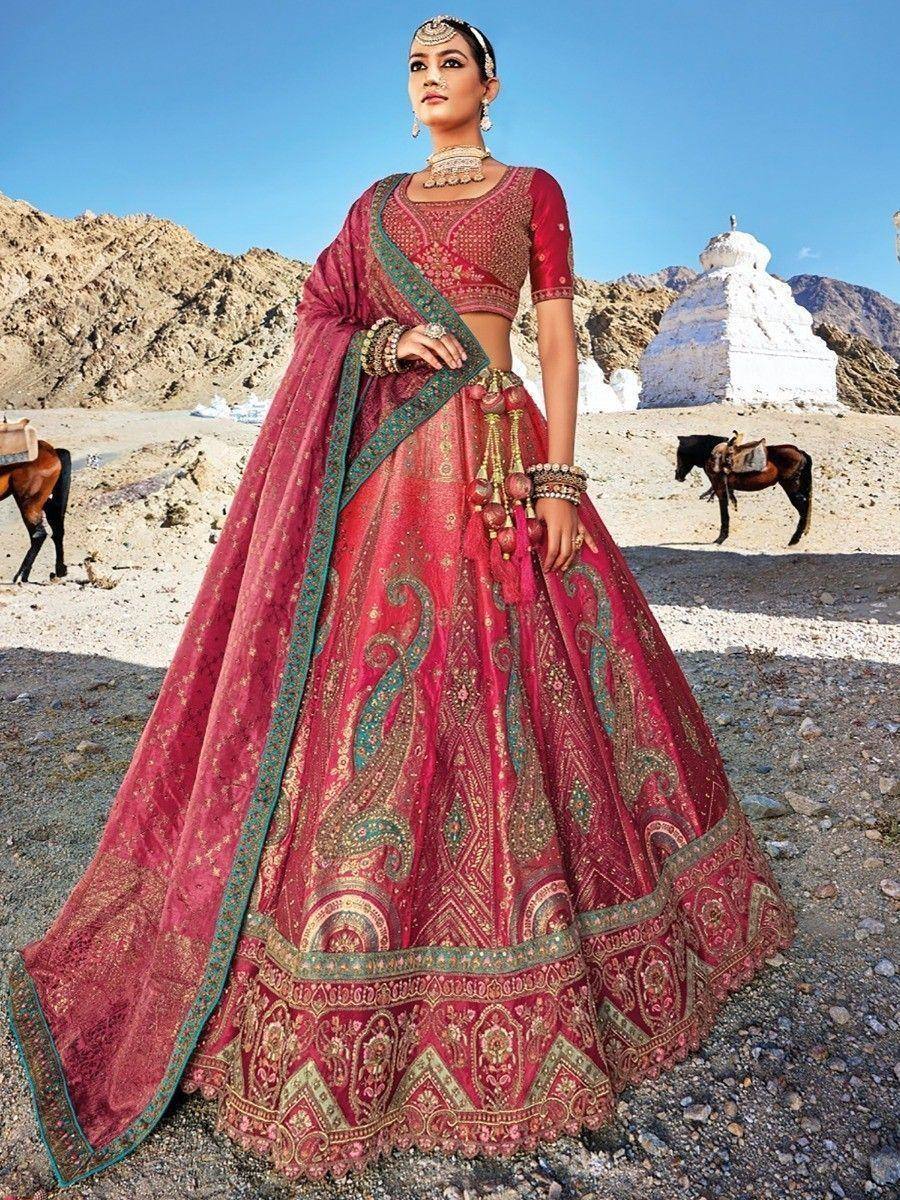 Red designer lehenga choli with gold embroidery, perfect for Indian weddings and ethnic events
