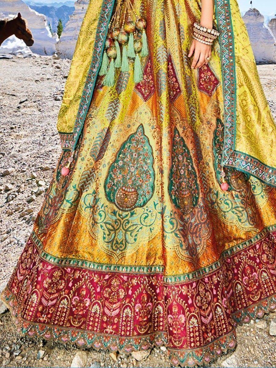 Vibrant yellow and red Indian lehenga choli with intricate embroidery, perfect for ethnic wear occasions.