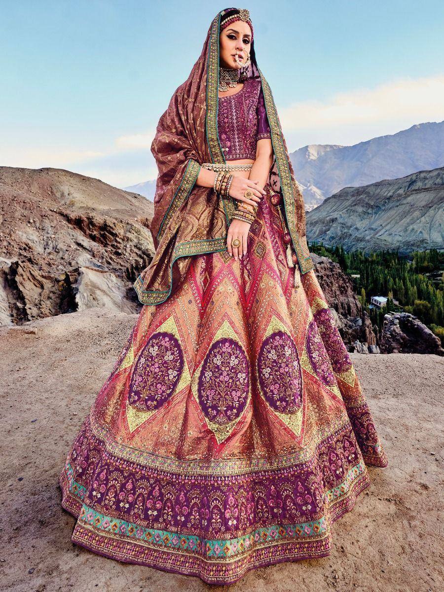 Elegant purple and gold embroidered lehenga choli with dupatta, perfect for Indian weddings and festive occasions.