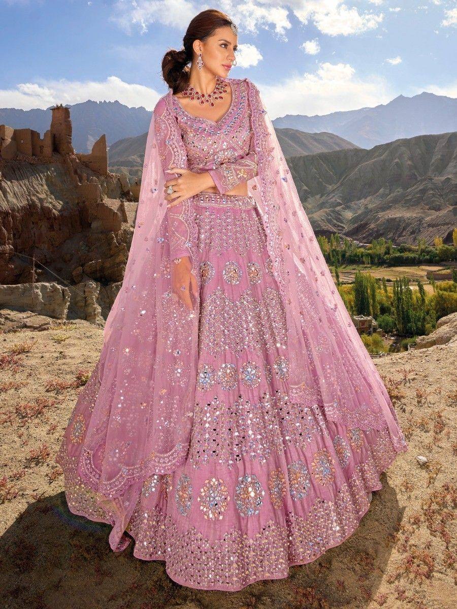 Pink designer lehenga choli with heavy embroidery, perfect for Indian weddings and festive occasions