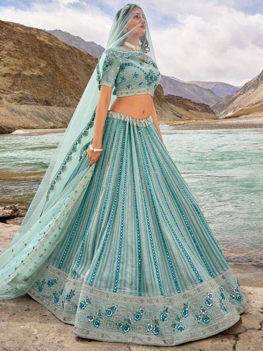 Mint green designer lehenga choli with sequin embroidery, perfect for Indian weddings and festive occasions.