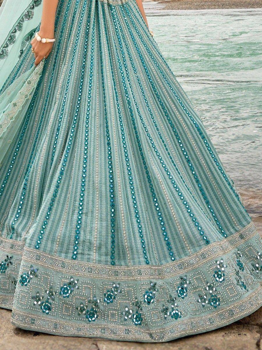 Teal designer lehenga with mirror work and floral embroidery, perfect for Indian ethnic wear occasions