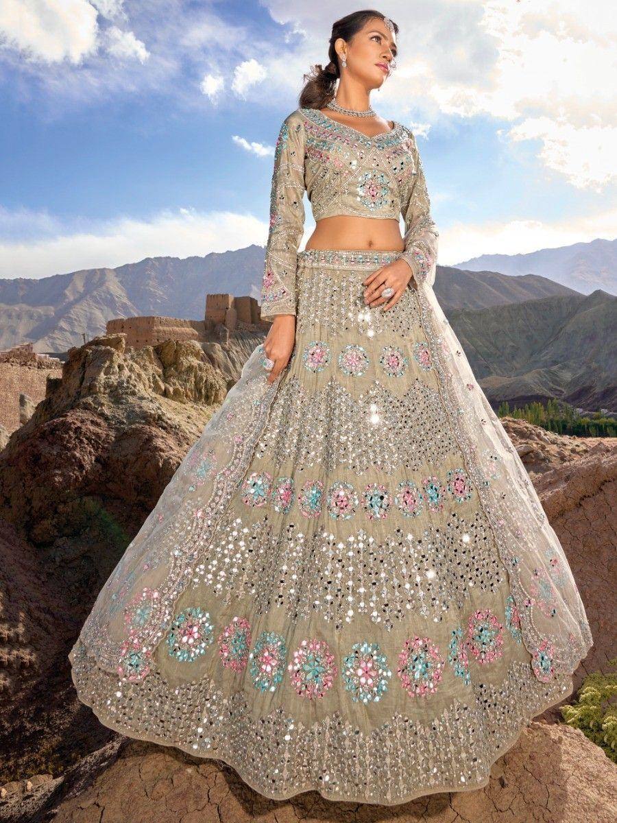 Beige floral embroidered lehenga choli with mirror work, perfect for Indian weddings and festive occasions