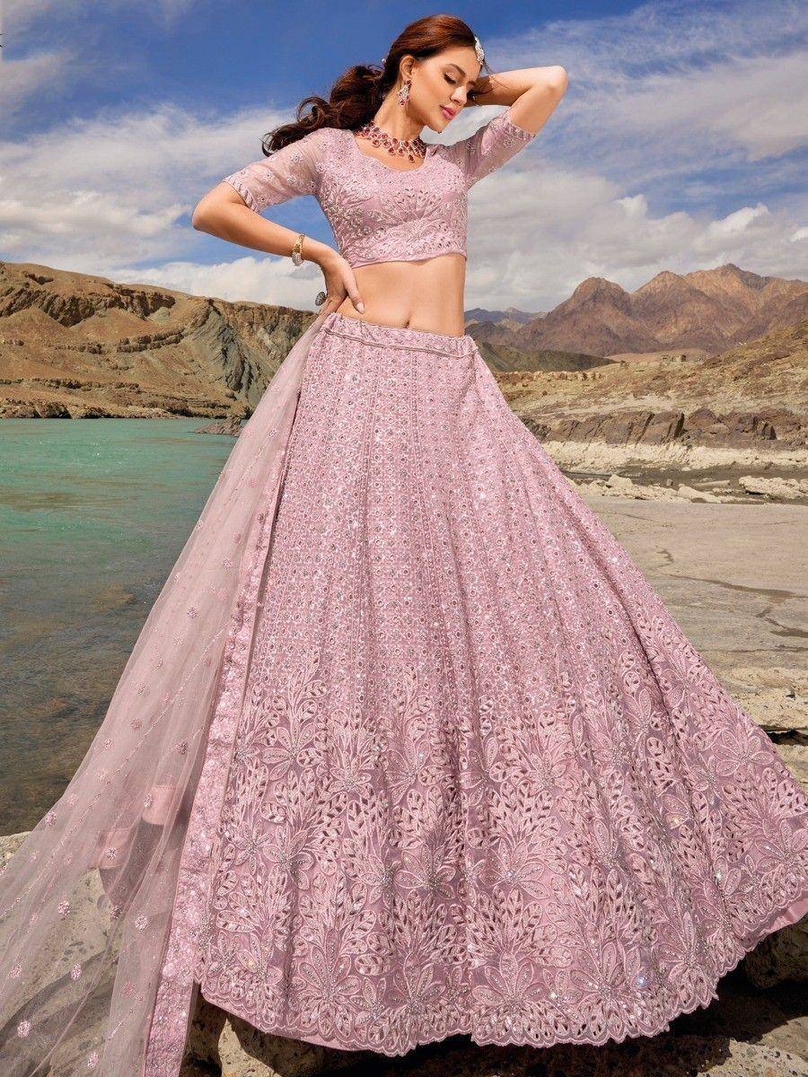 Pink embroidered lehenga choli with sheer dupatta, perfect for Indian weddings and festive occasions