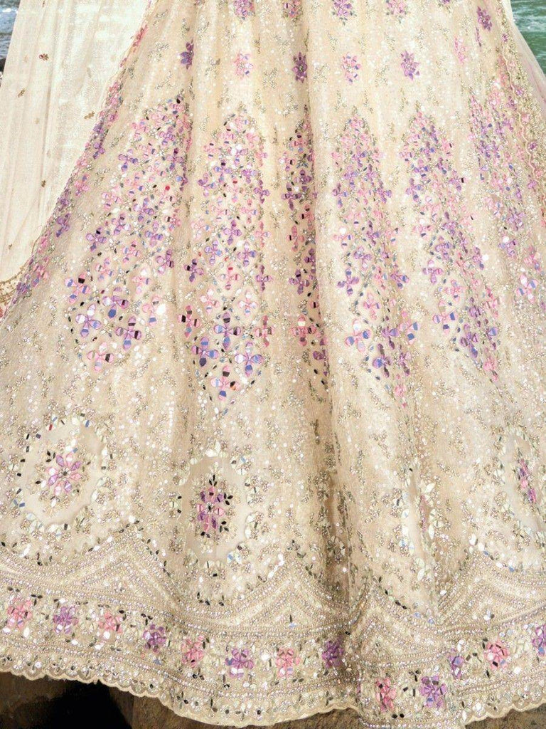 Enchanting Cream Mirror Work Net Engagement Wear Lehenga Choli