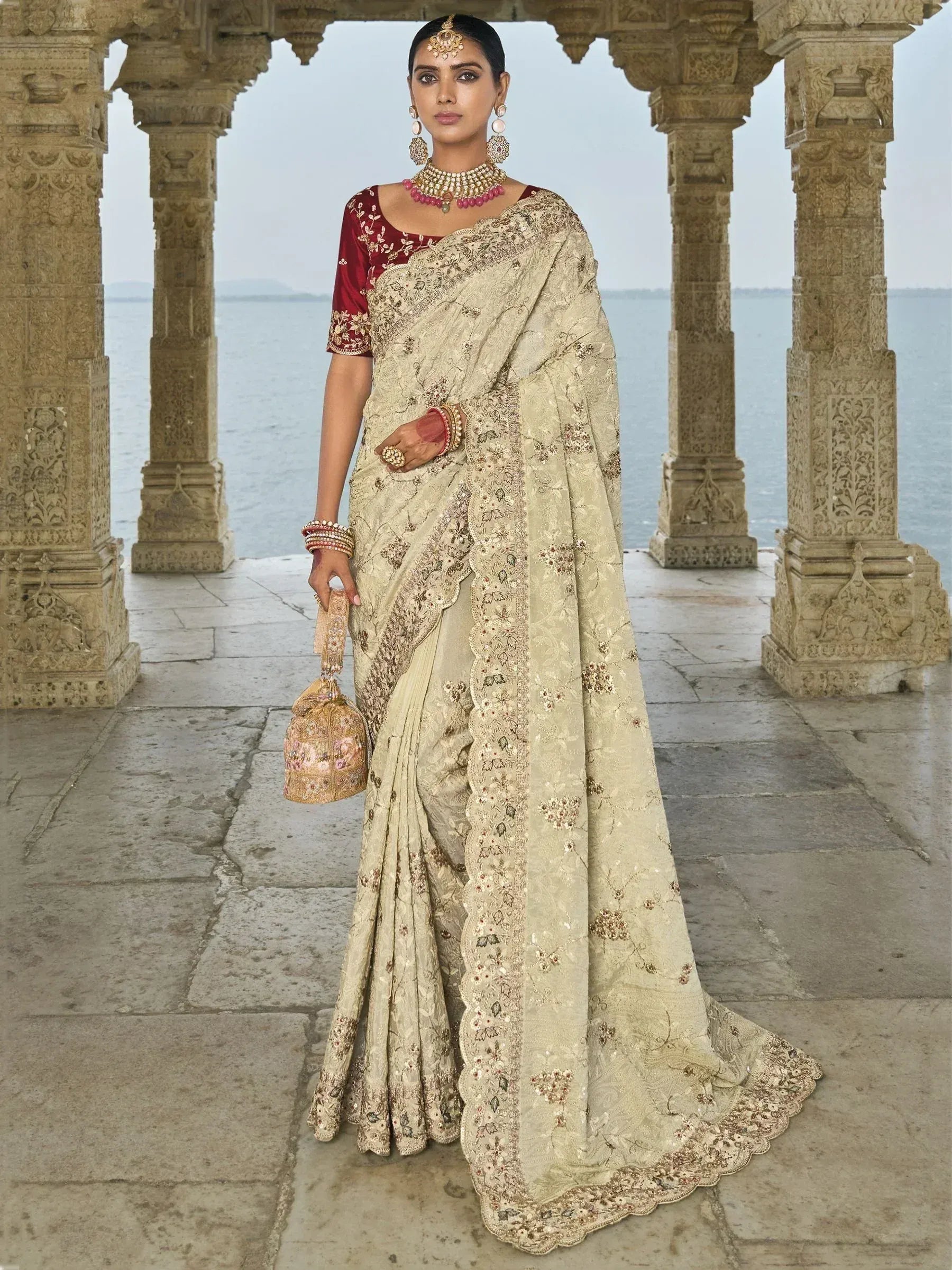 Elegant cream embroidered saree with red blouse, traditional Indian ethnic wear, perfect for weddings and festivals