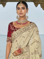 Tantalizing Off-White Embroidered Banarasi Silk Wedding Wear Saree