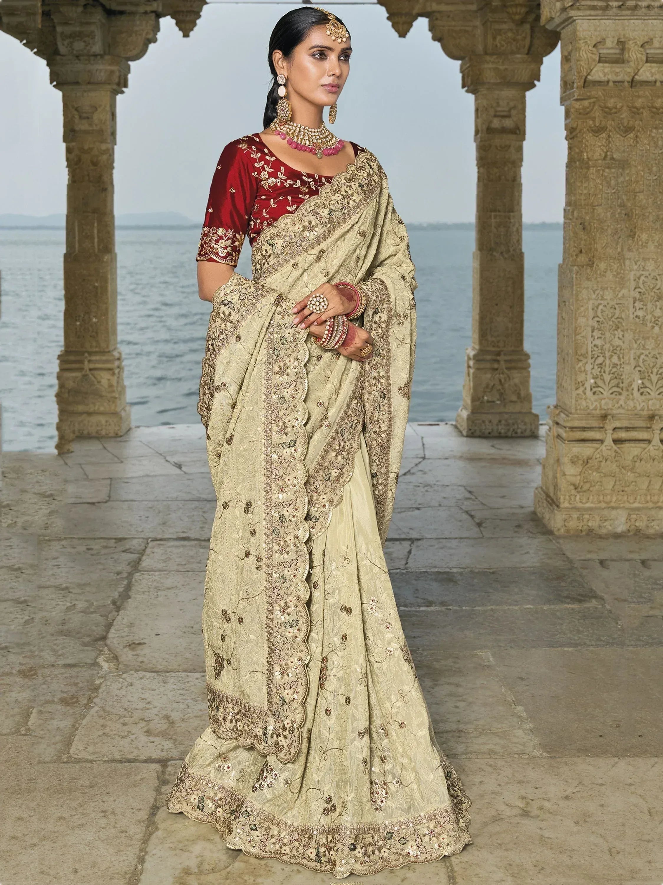 Elegant beige embroidered saree with red blouse, perfect for Indian ethnic wear occasions