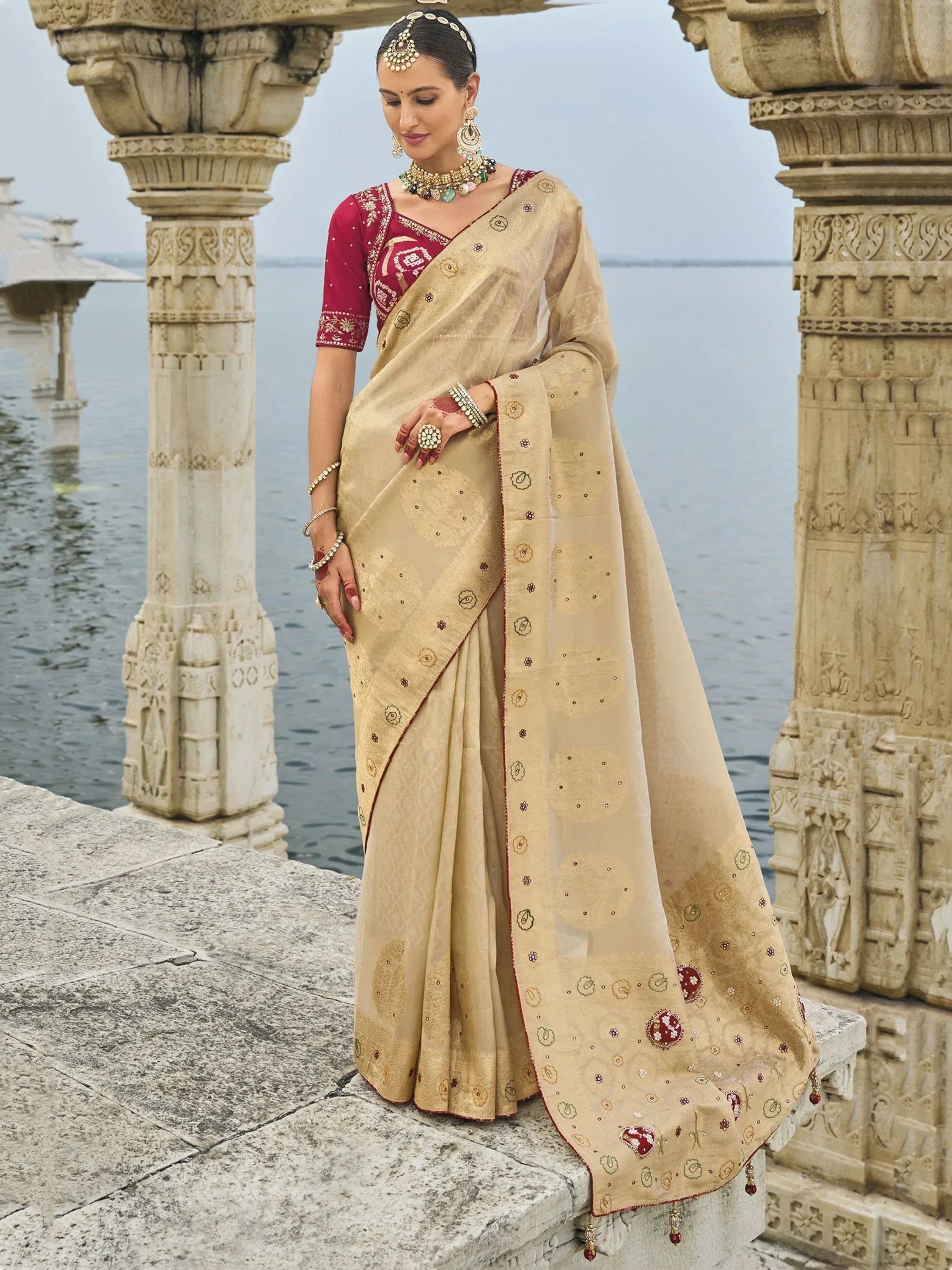 Elegant beige embroidered saree with red blouse, traditional Indian ethnic wear, perfect for weddings and festivals