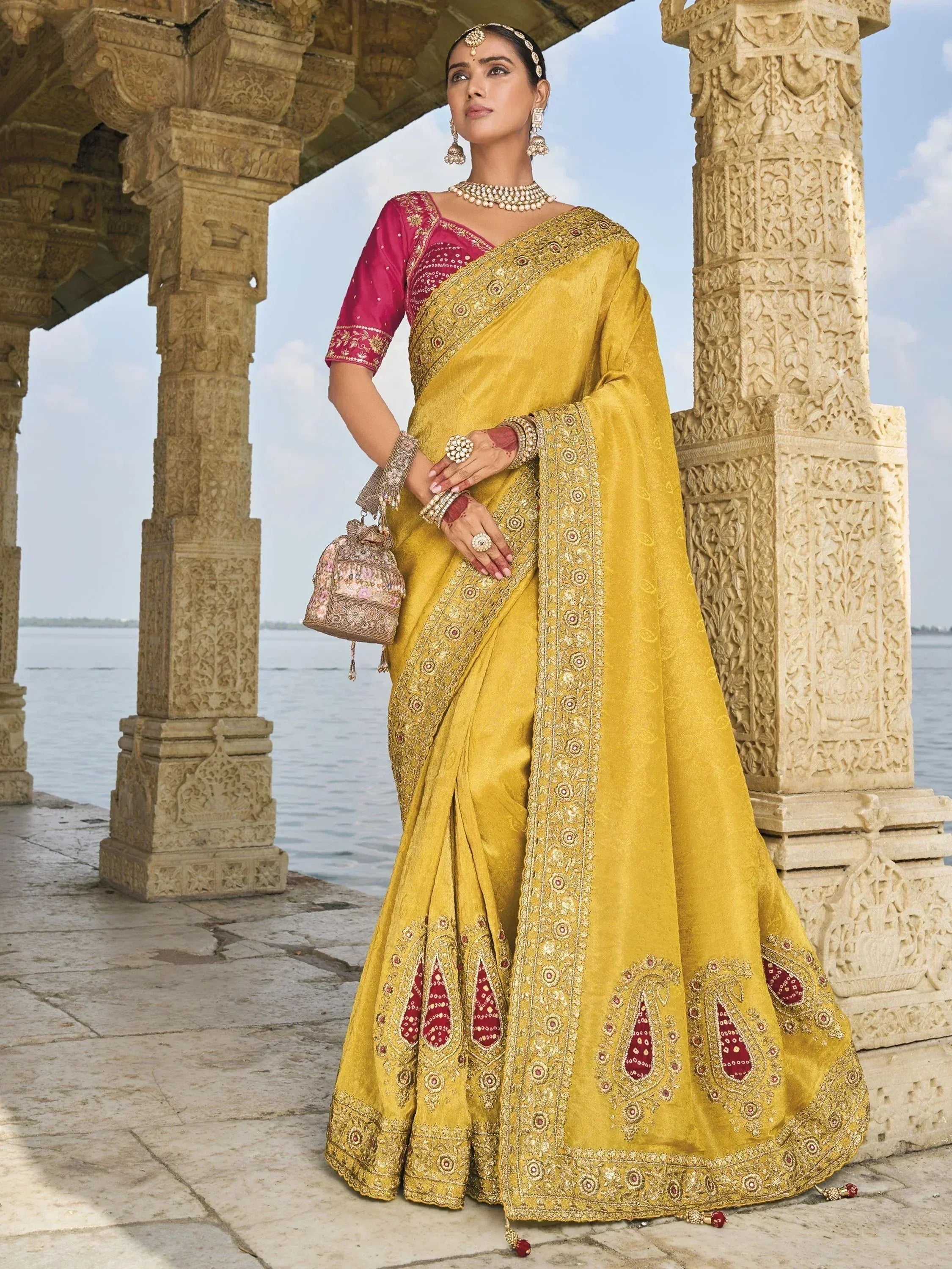 Yellow embroidered saree with pink blouse, traditional Indian ethnic wear, perfect for weddings and festivals