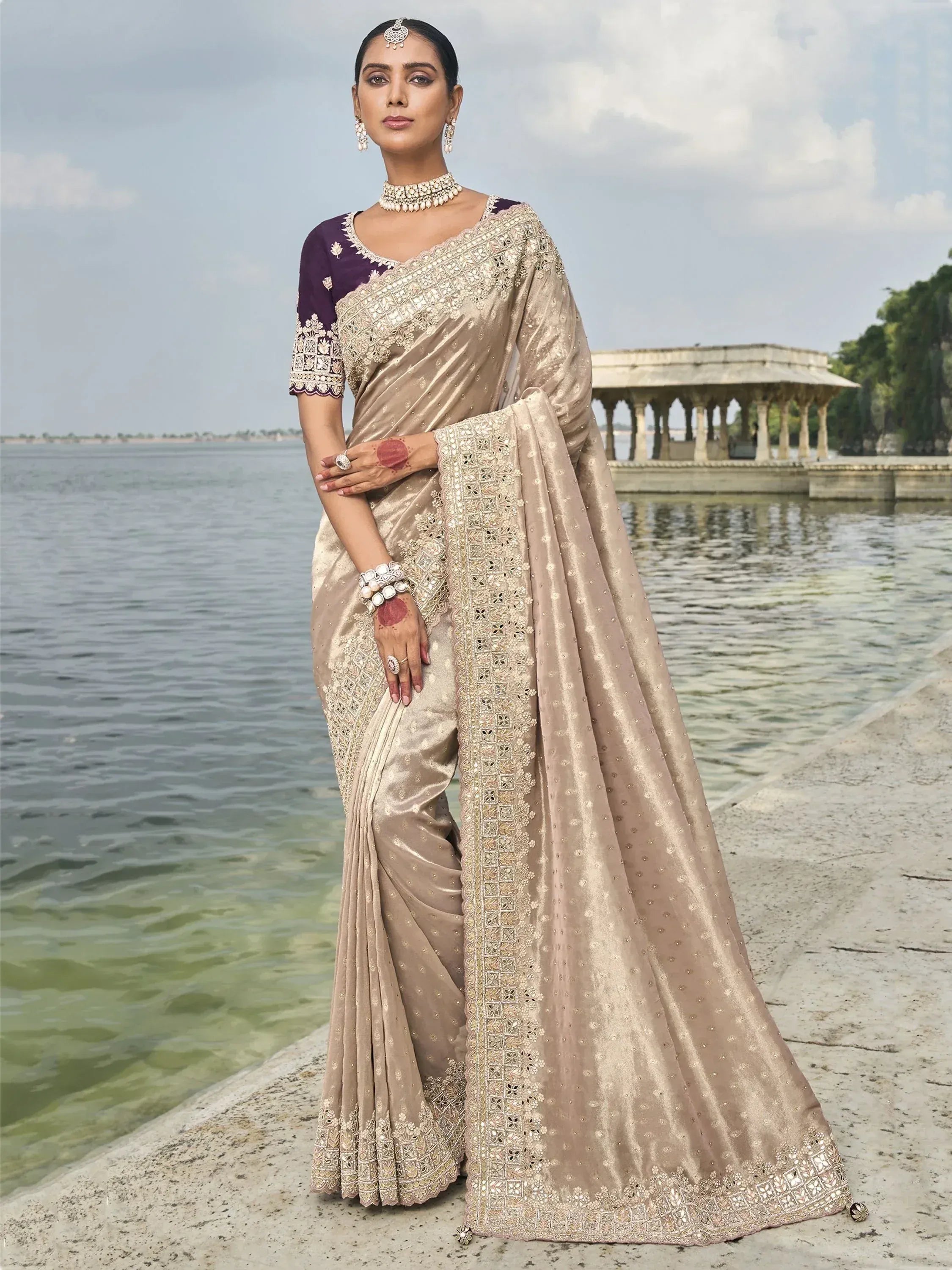 Elegant beige embroidered saree with purple blouse, perfect for Indian ethnic wear occasions