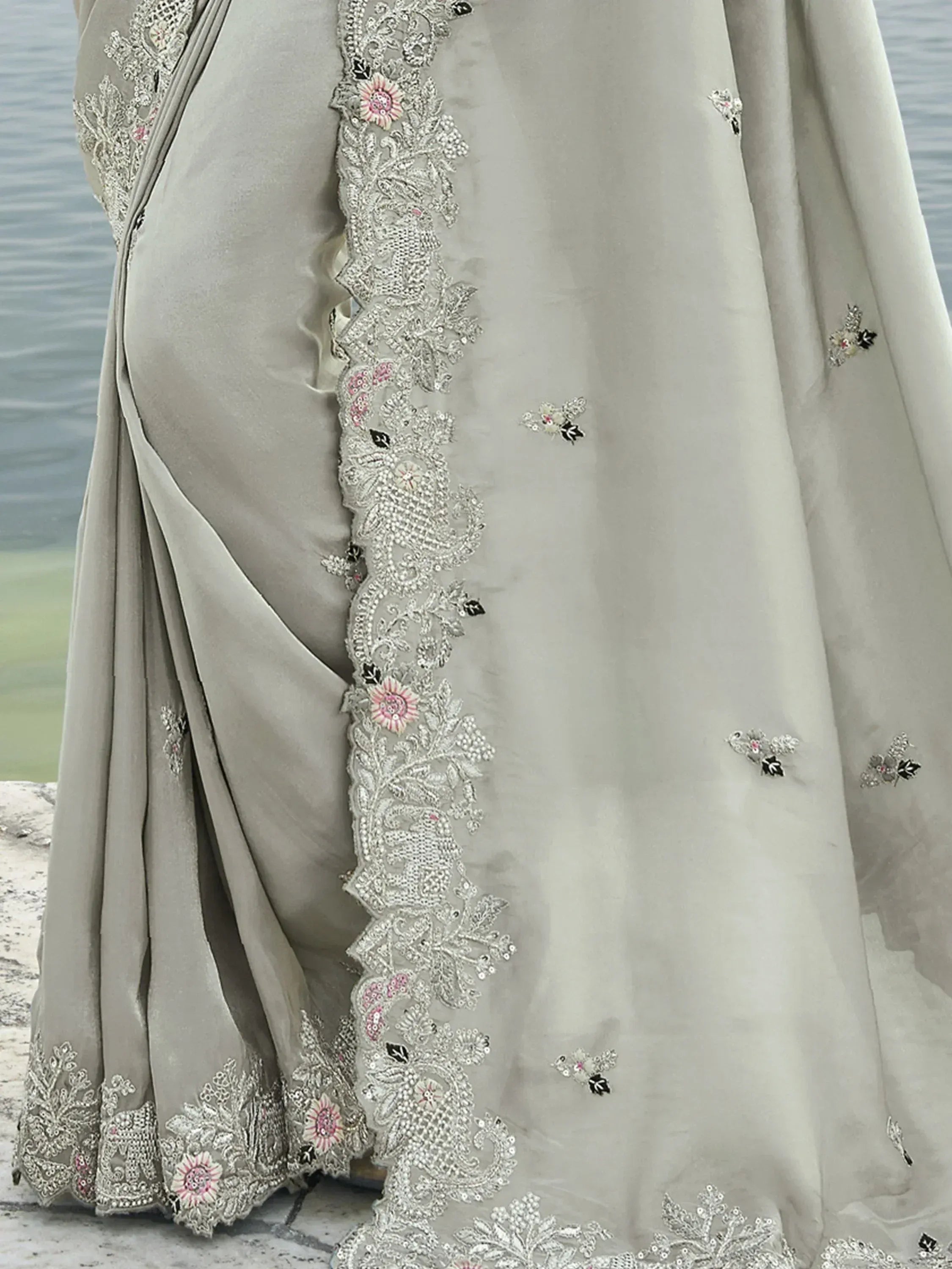 Grey designer saree with intricate floral embroidery and sequin work, perfect for ethnic occasions.