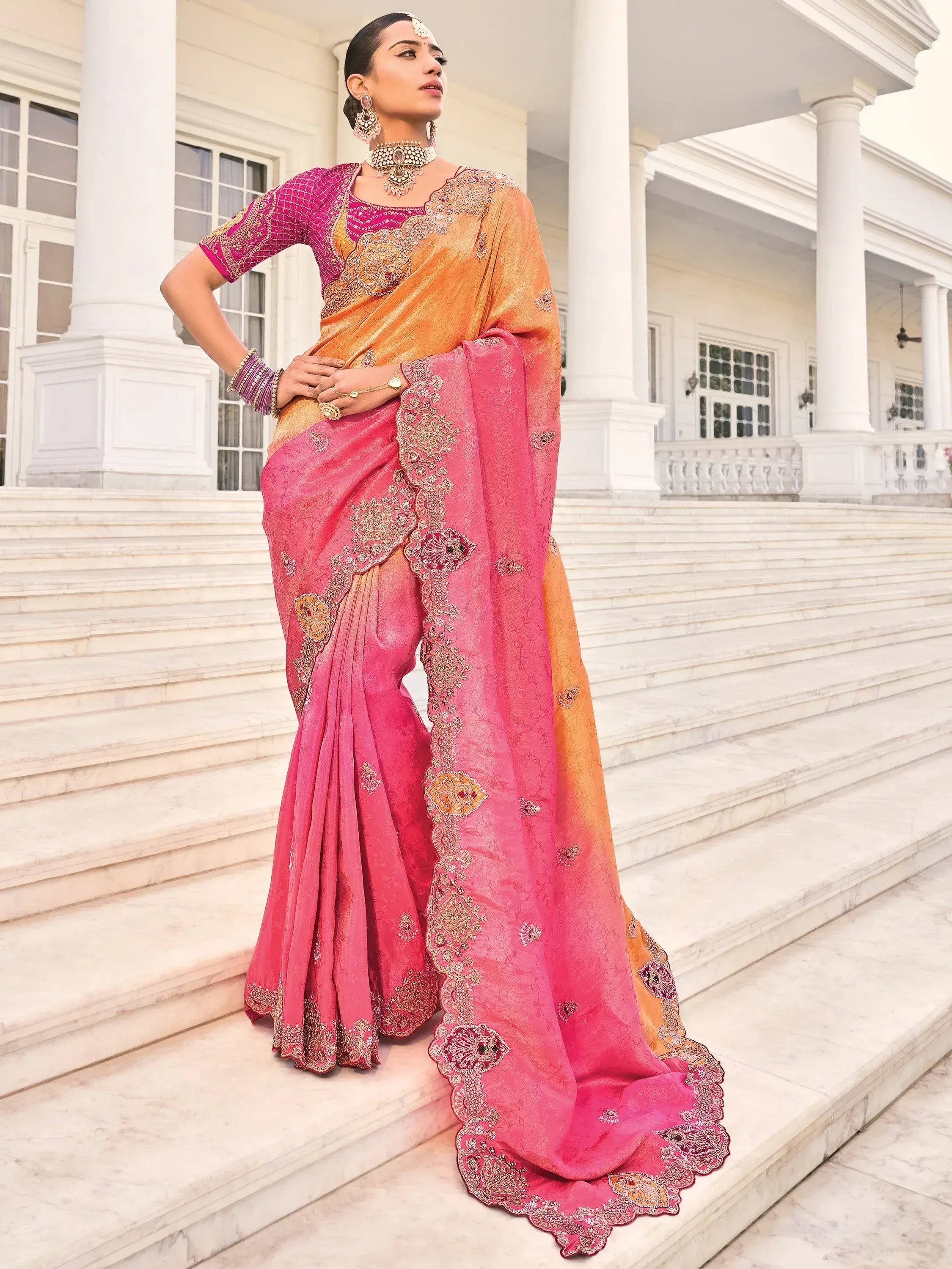 Elegant pink and orange embroidered saree with designer blouse, perfect for Indian ethnic occasions.