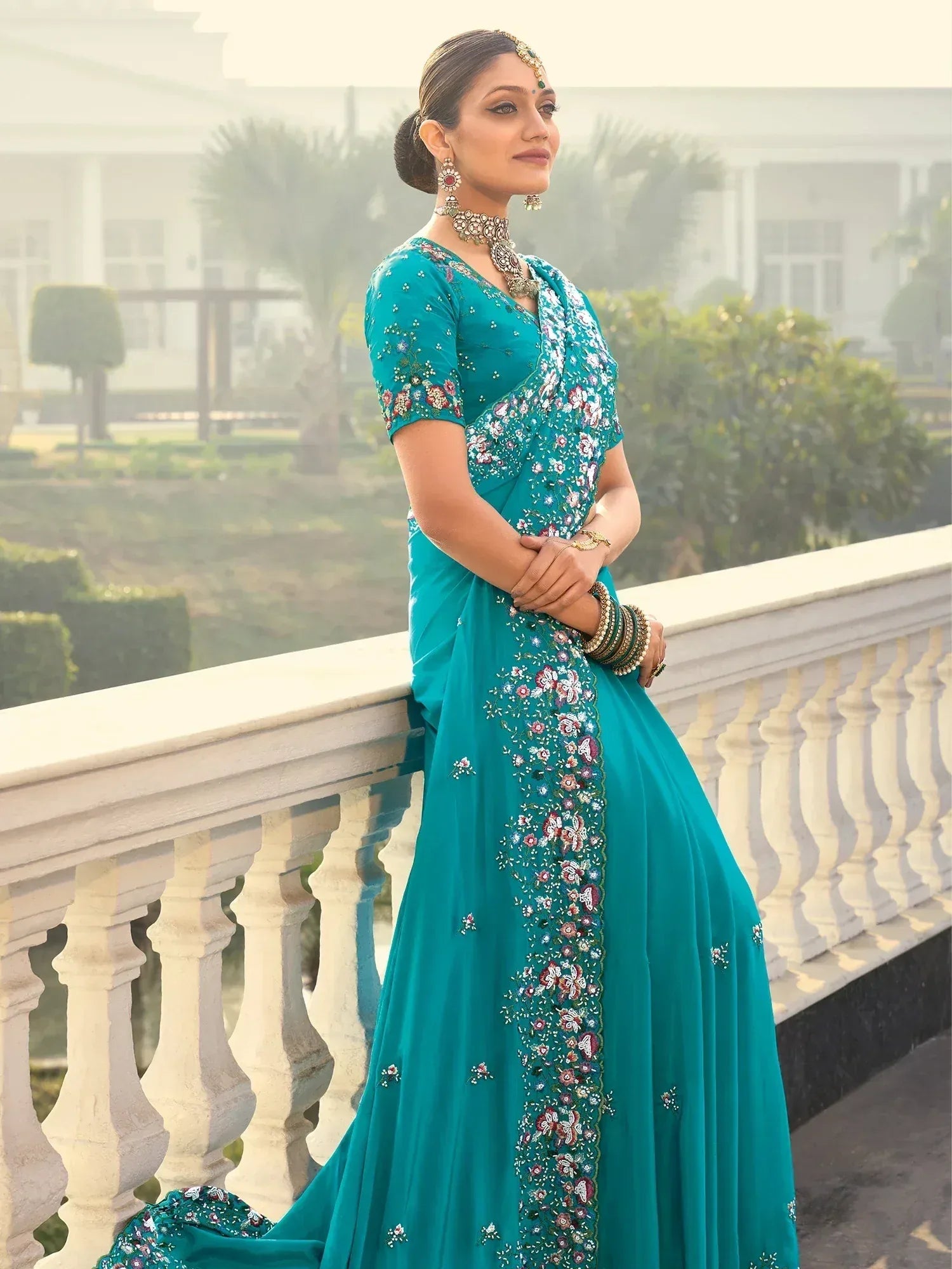 Teal floral embroidered saree with designer blouse, perfect for Indian ethnic occasions