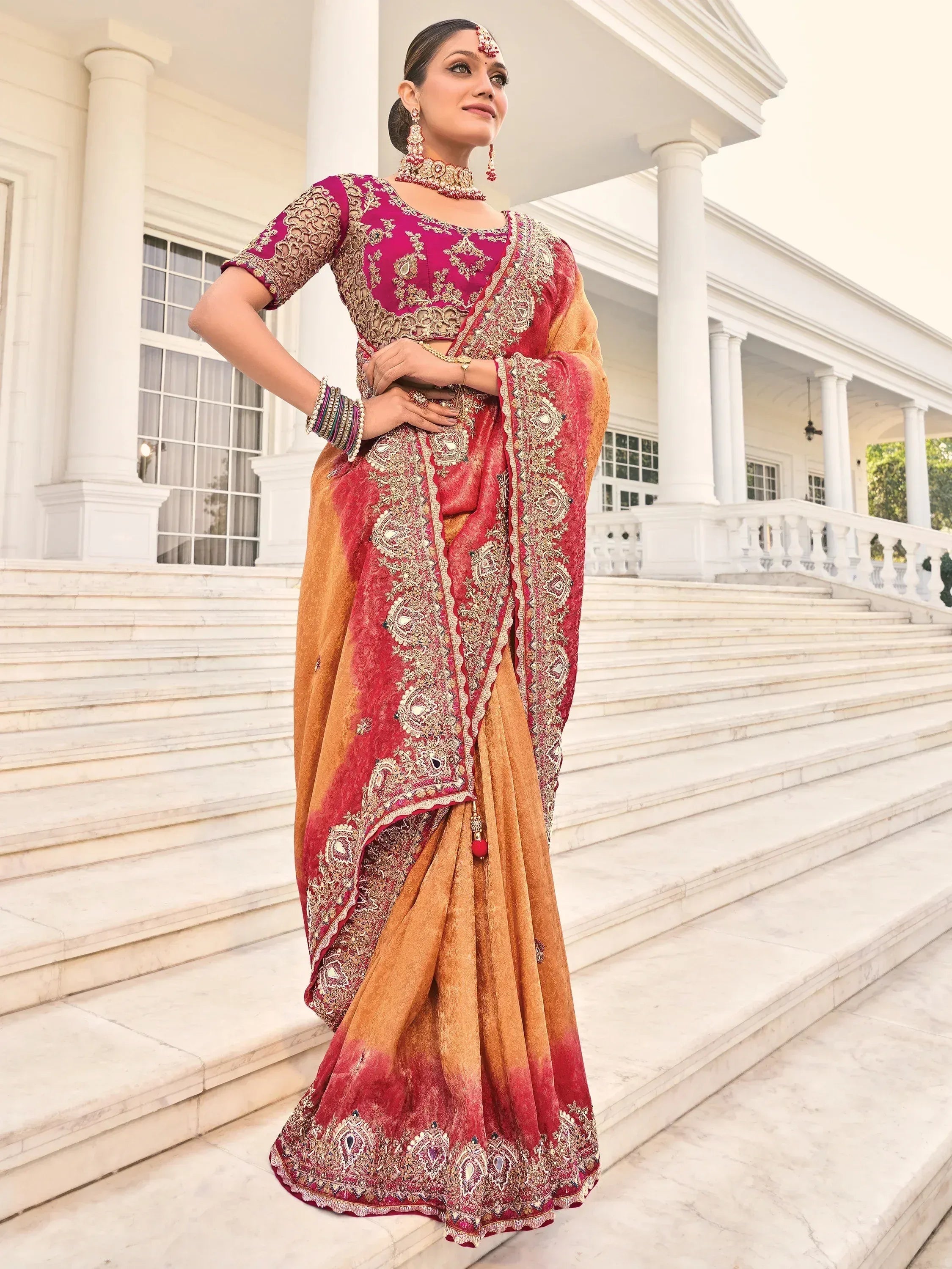 Elegant maroon and gold embroidered saree with designer blouse, perfect for Indian ethnic wear occasions.