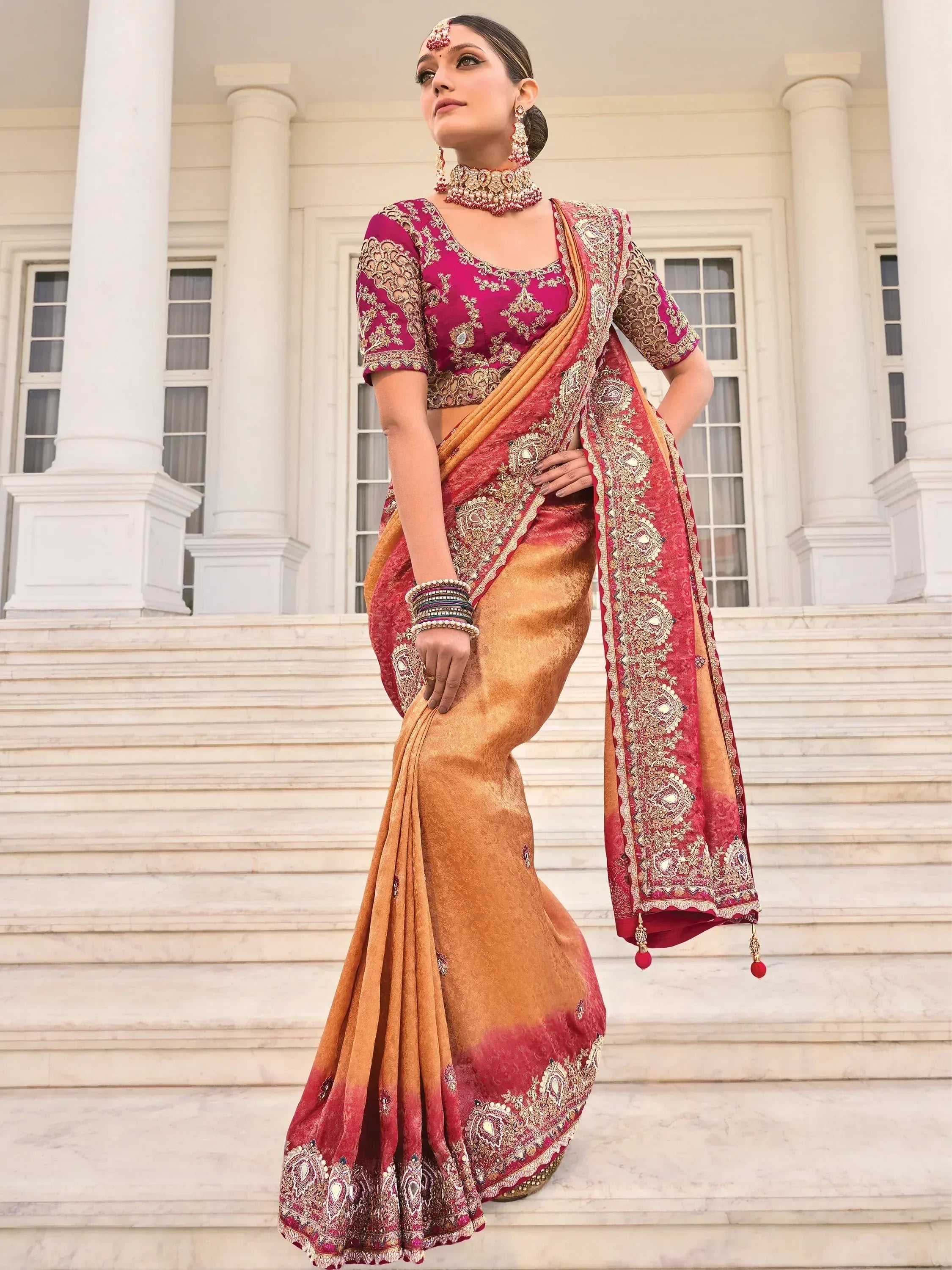 Elegant maroon and gold embroidered saree with designer blouse, perfect for Indian ethnic occasions