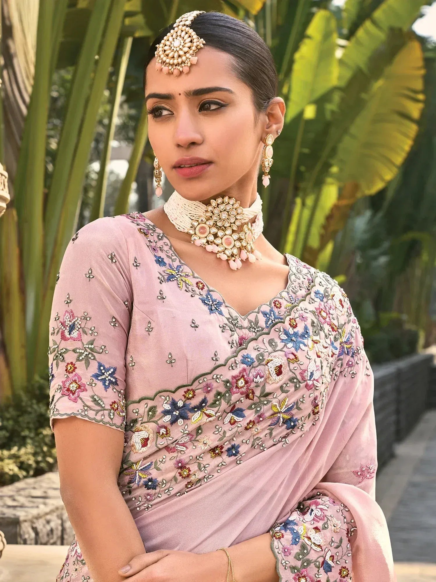 Elegant pink floral embroidered saree with traditional jewelry for Indian ethnic wear