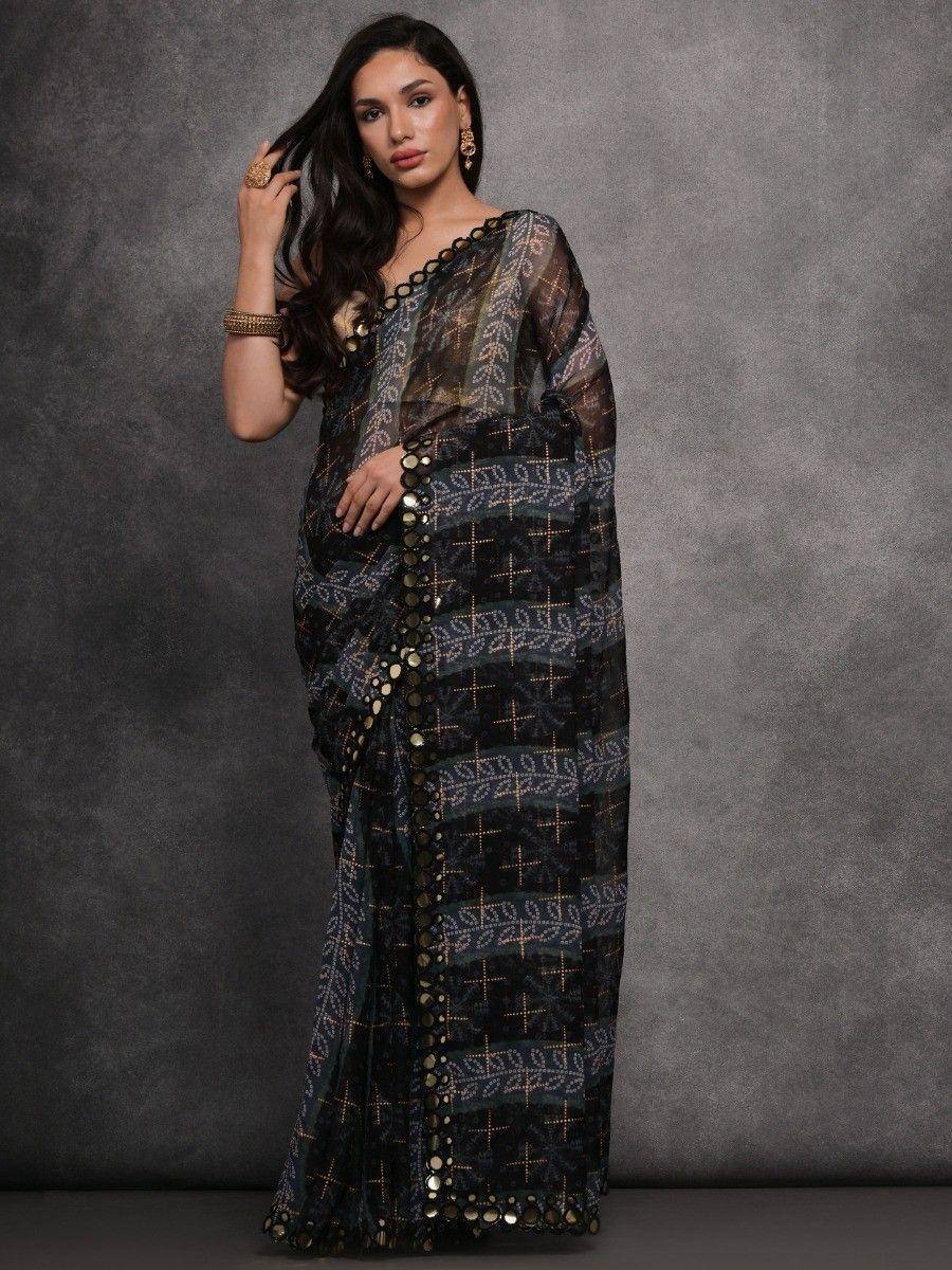 Elegant black and gold printed saree with mirror work, perfect for ethnic occasions