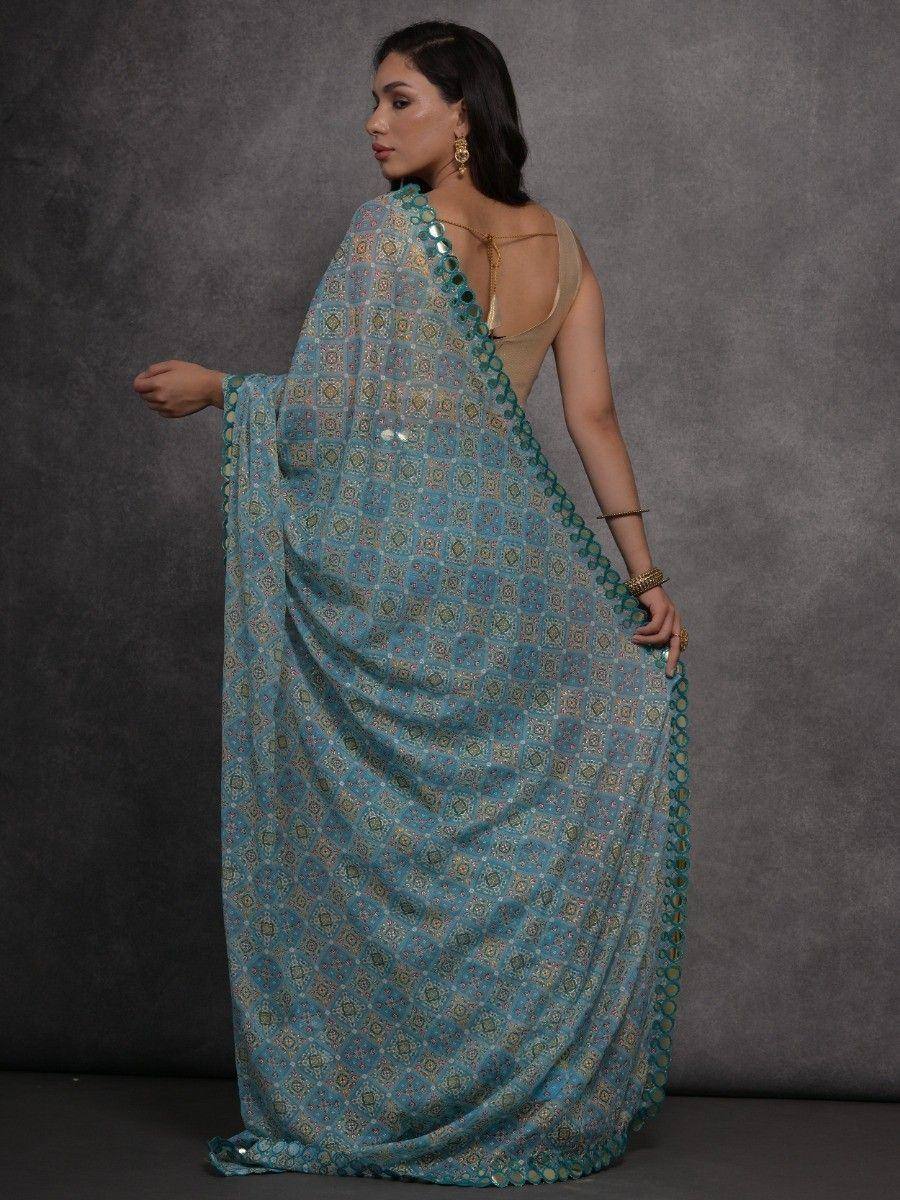 Blue printed saree with sequin border, styled with backless blouse for ethnic wear