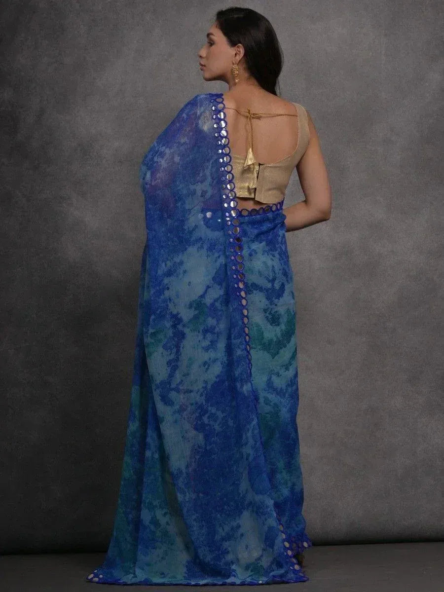 Blue tie-dye saree with mirror work, paired with gold blouse, ethnic Indian wear