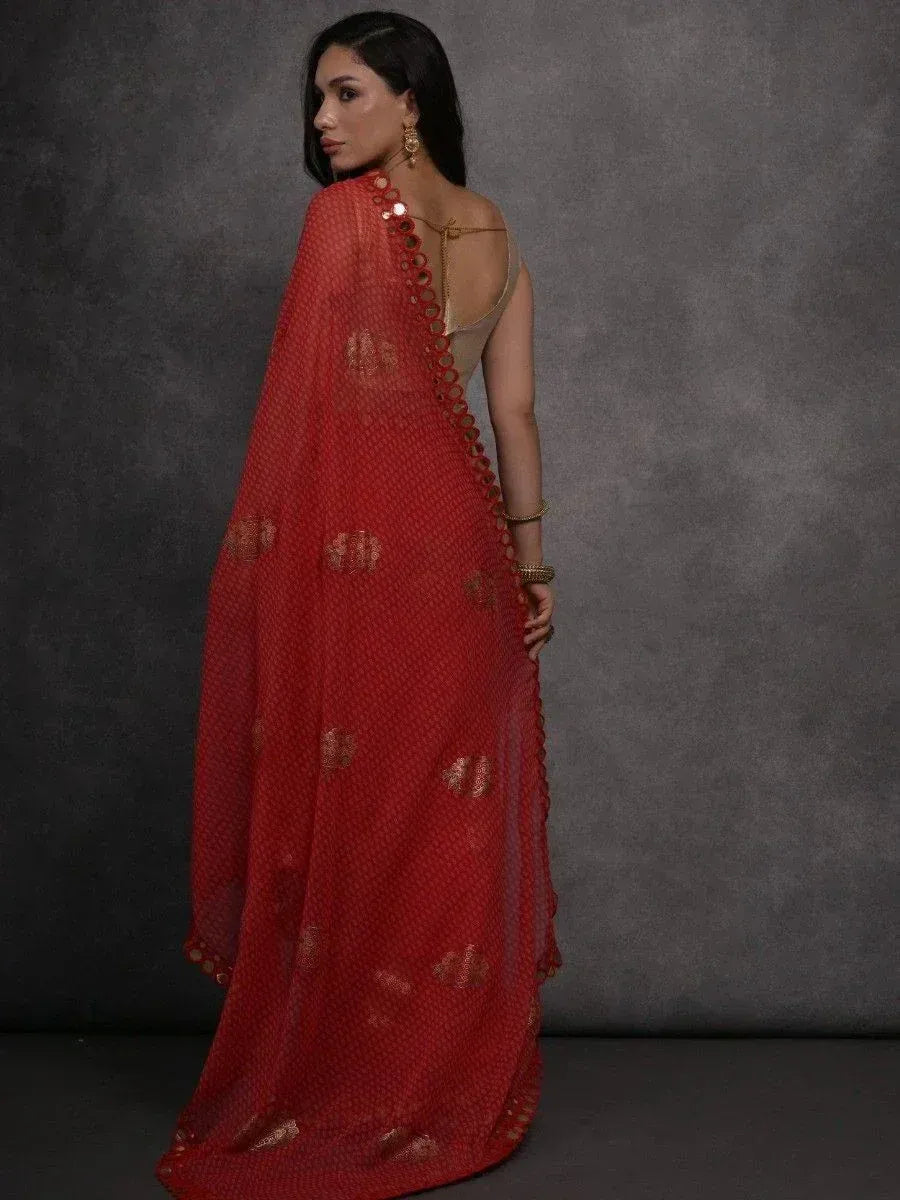 Red embroidered saree with gold accents, stylish Indian ethnic wear for women