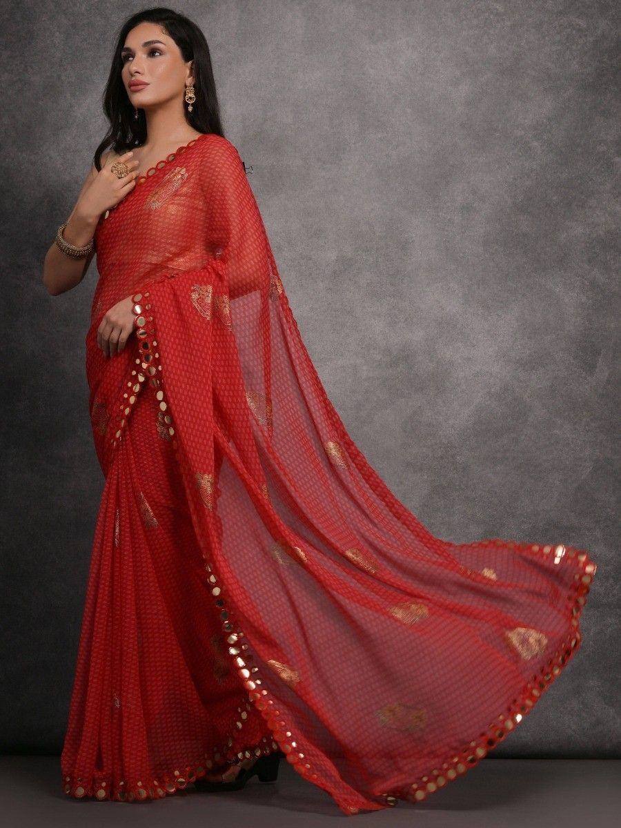 Red designer saree with gold embroidery and mirror work, perfect for ethnic occasions