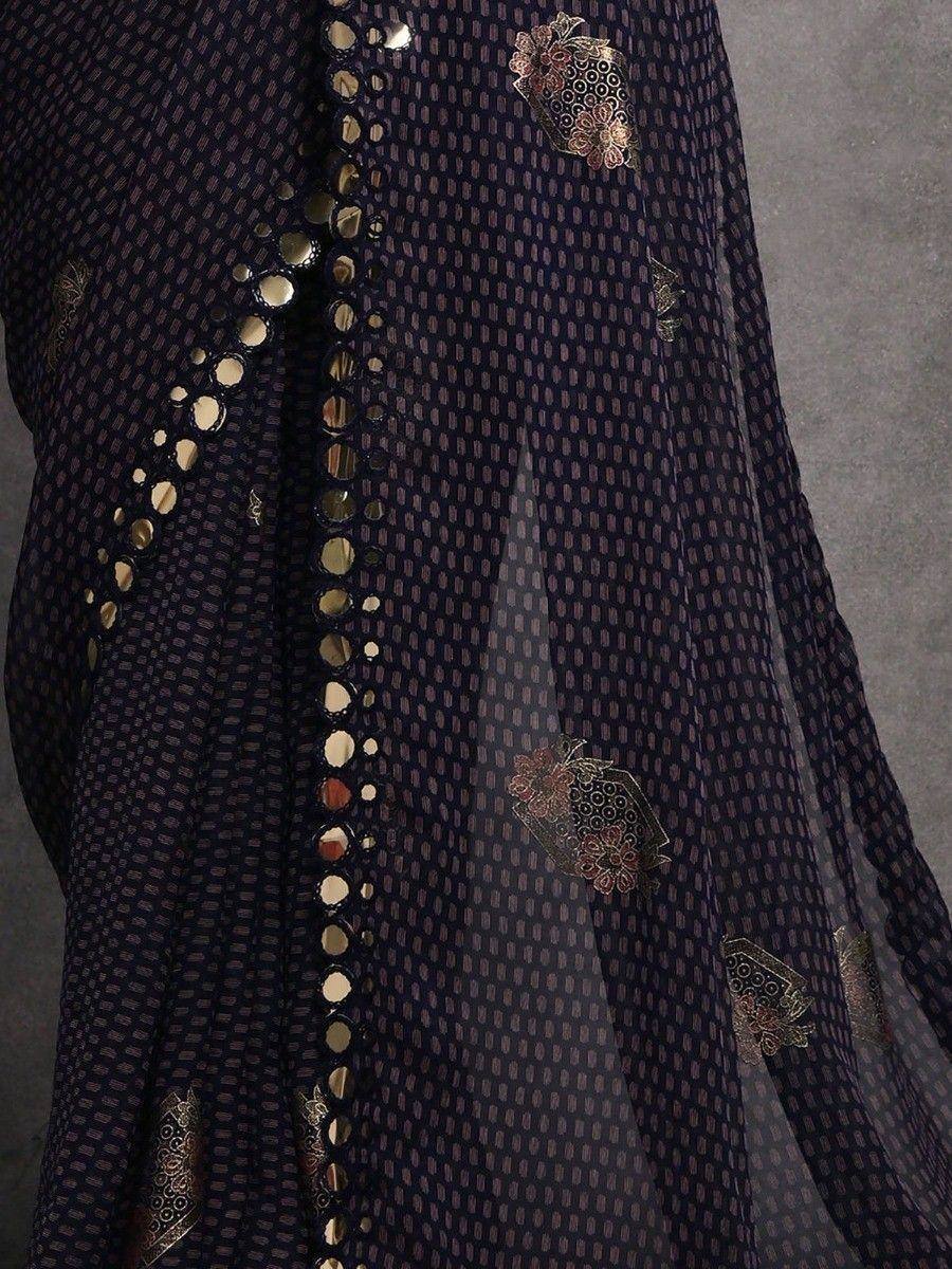 Elegant navy blue ethnic gown with gold mirror work and floral embroidery, perfect for Indian occasions.