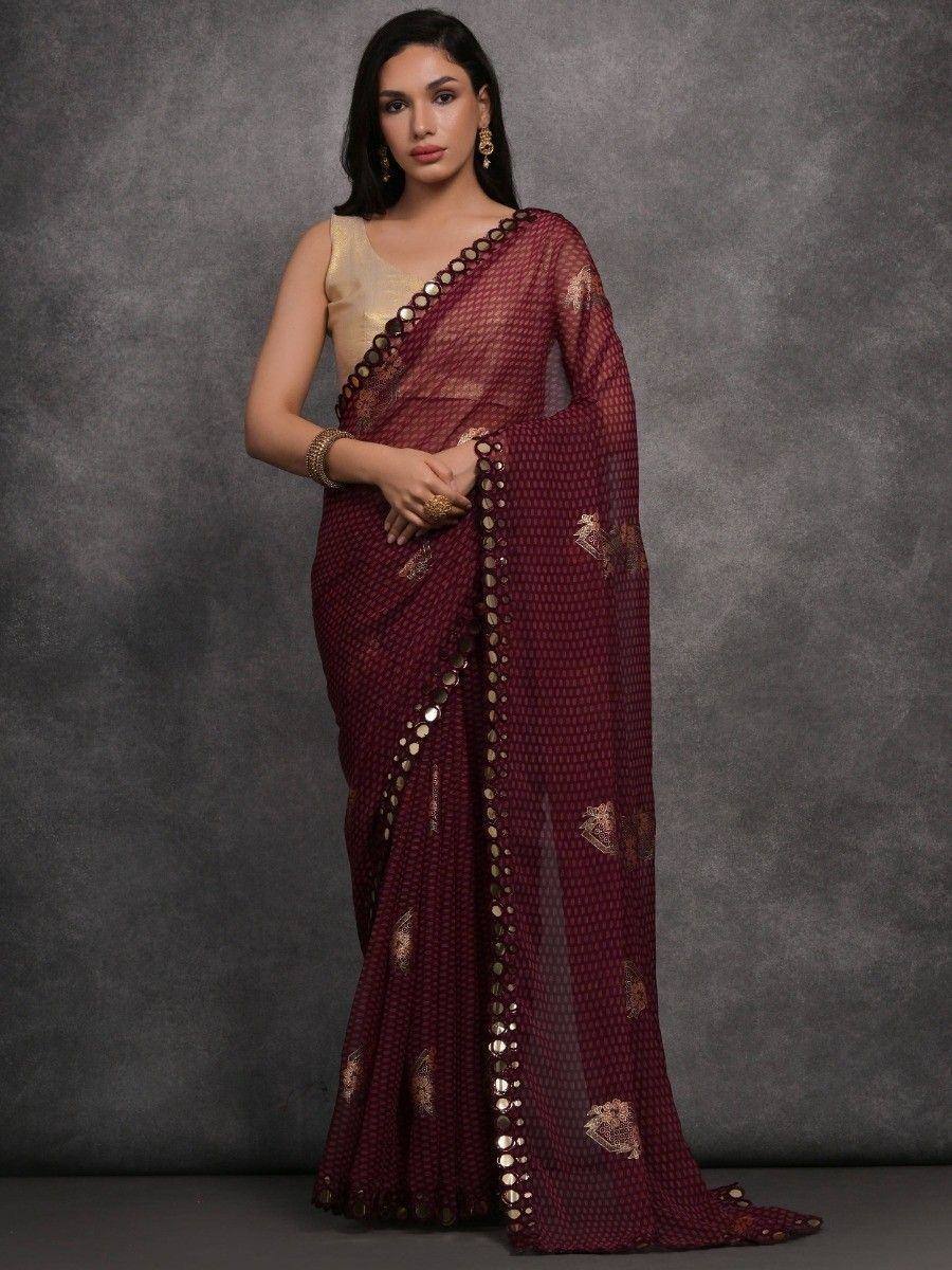 Maroon ethnic saree with gold mirror work and blouse, perfect for Indian occasions