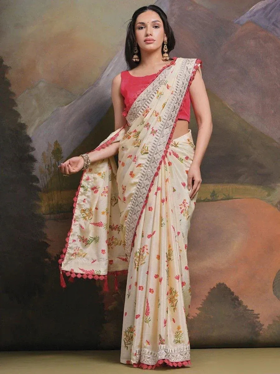 Floral printed cream saree with pink border and lace detailing, paired with red blouse, ideal for ethnic occasions