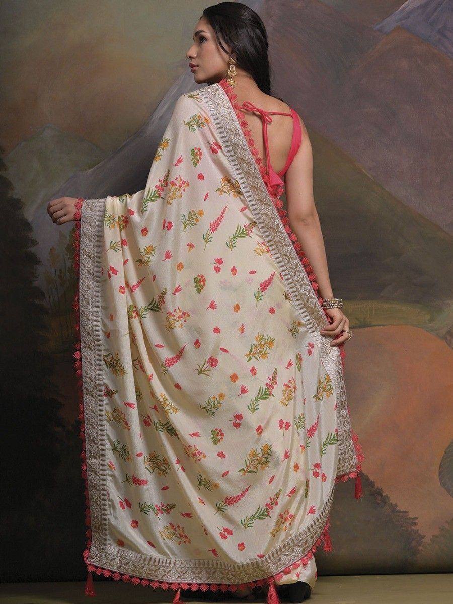 Floral printed ethnic saree with pink tassels and lace border, styled with back-tie blouse