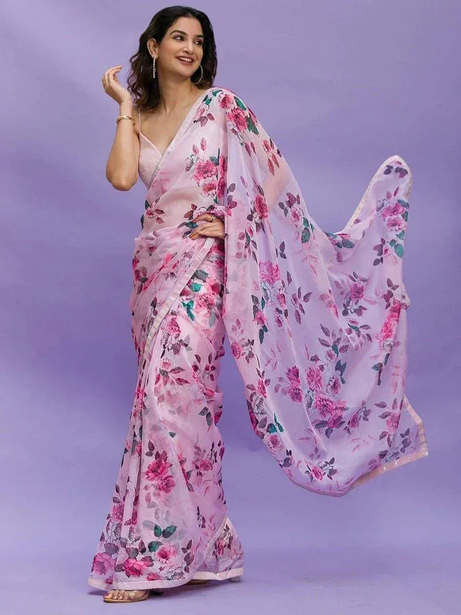 Pink floral print saree with sheer pallu, styled with sleeveless blouse for ethnic occasions