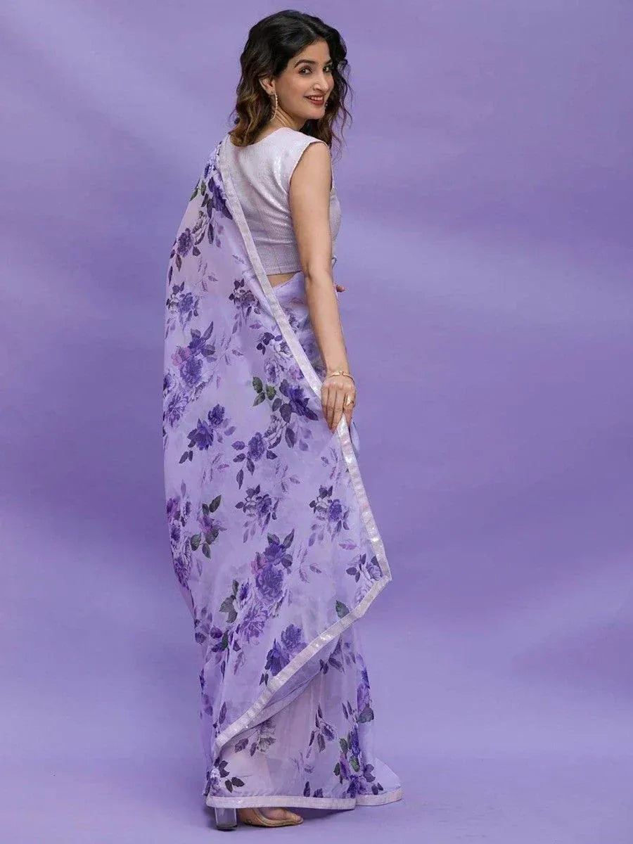 Woman in purple floral print saree with silver blouse, ethnic Indian wear